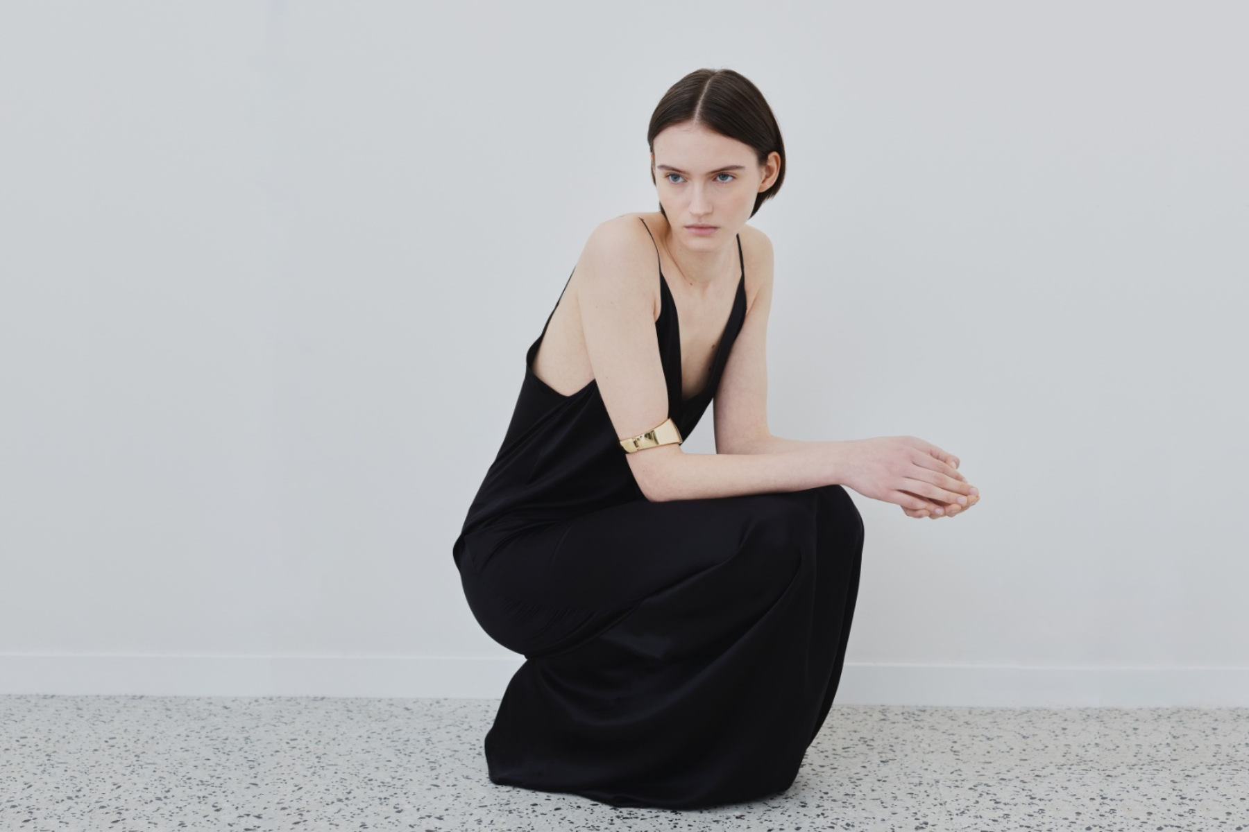 Model wearing the Inez dress in black organic silk — featured in HERTH’s Journal article “Summer in Organic Silk: What We’re Taking With Us,” highlighting timeless and conscious summer essentials.