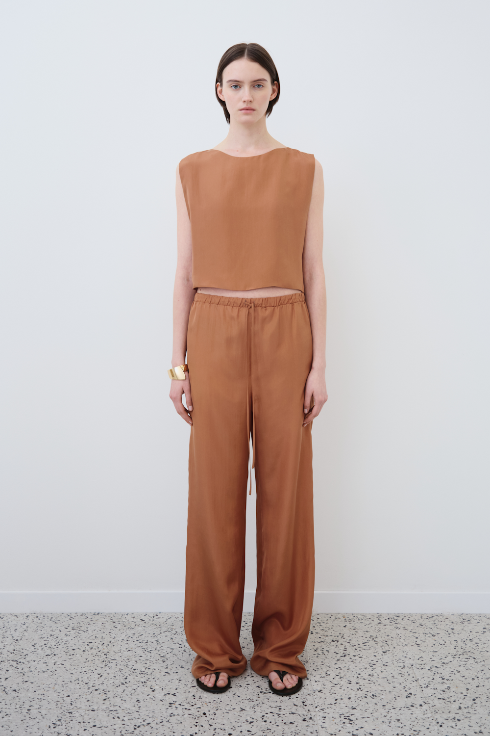 Front view of the Ariel cropped top and Jody silk trousers in Earth — a refined minimalist set by HERTH in GOTS-certified organic silk. Luxury sustainable womenswear by HERTH.