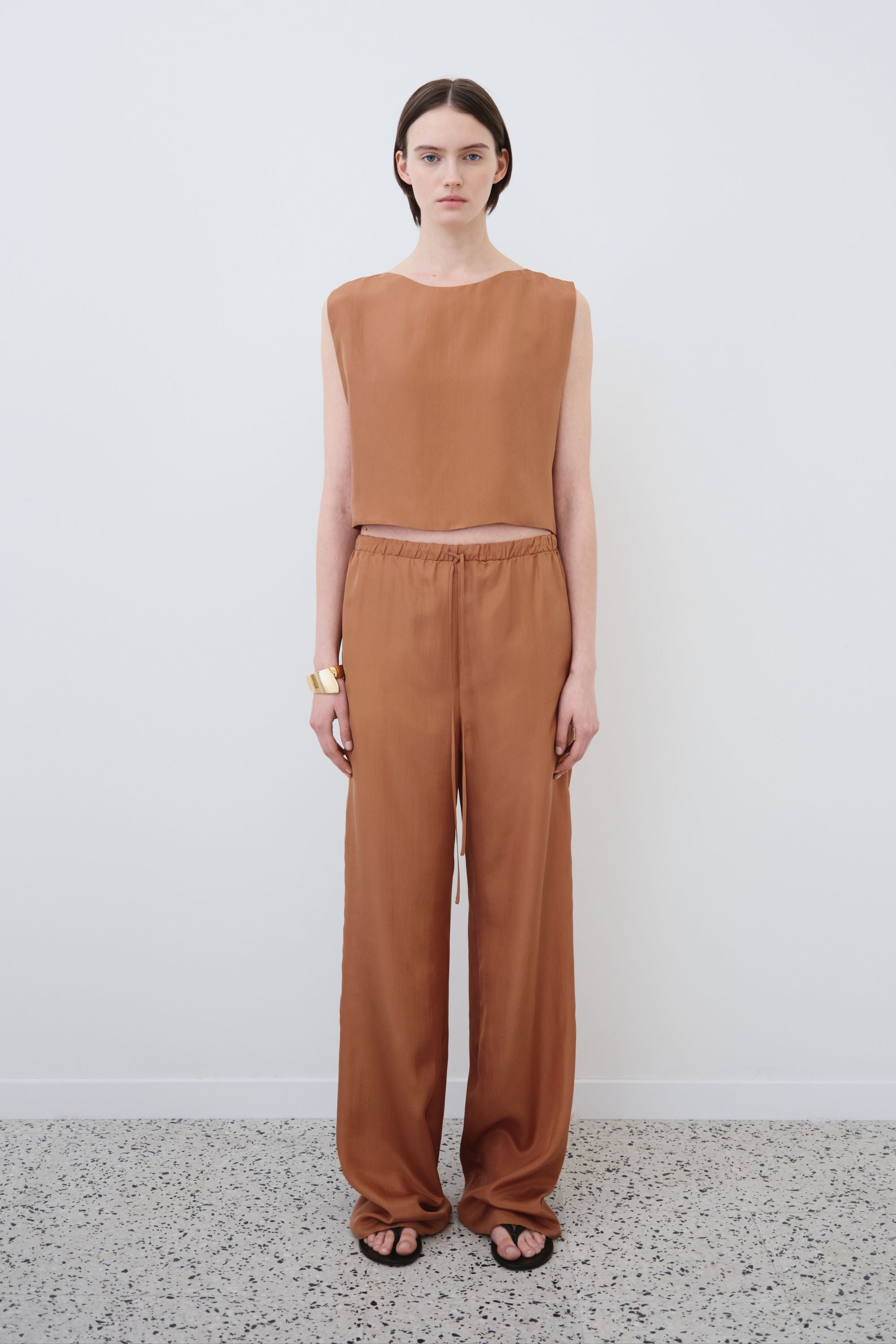 Model wearing organic habotai silk top and trousers set in earth tone, Ariel top and Jody trousers made in Italy, front view