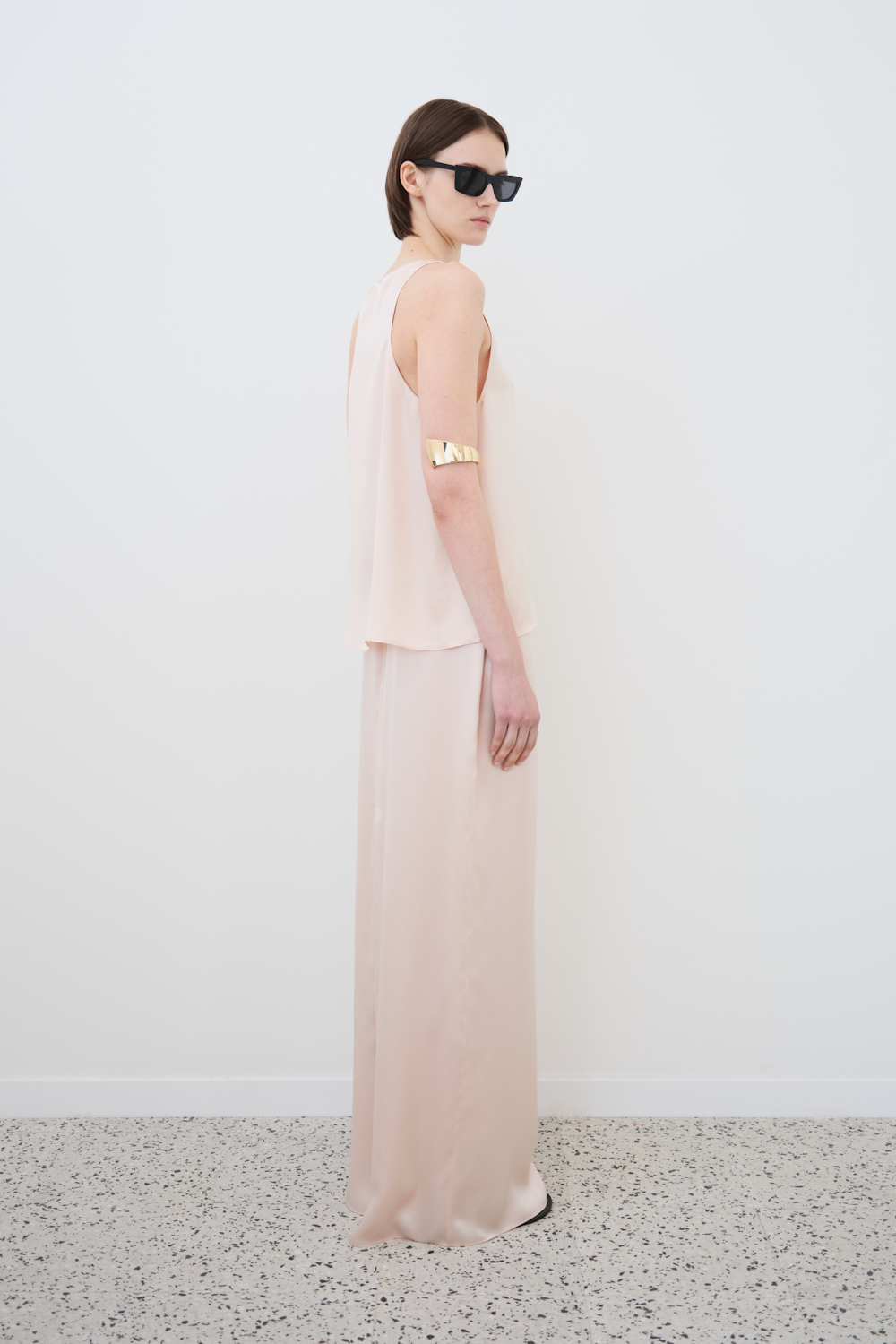 Side view of Eda tank and Nilde skirt in Whisper Pink – timeless organic silk separates styled for effortless elegance by HERTH. Luxury sustainable womenswear by HERTH.