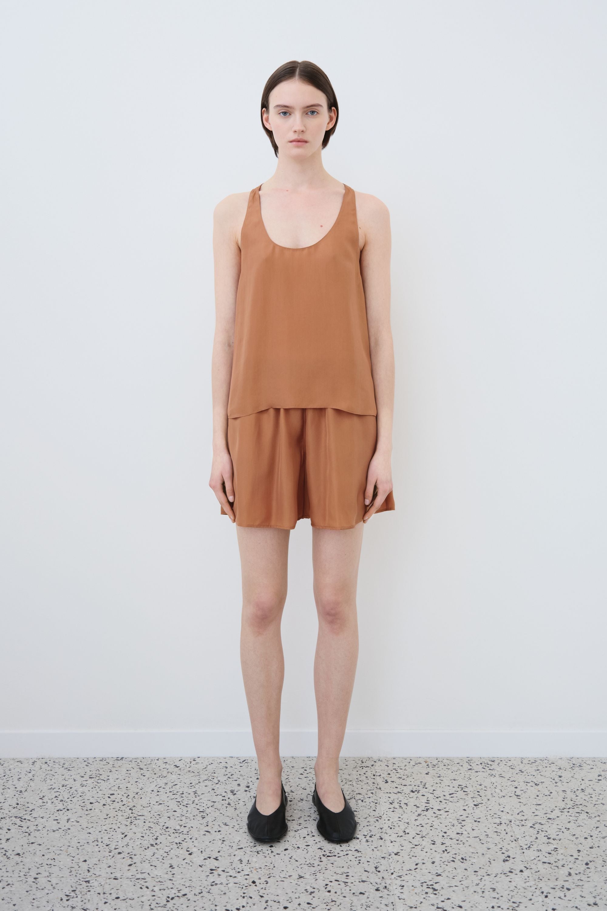 Model wearing organic silk tank top and shorts set in earth tone, Eda tank and Hani shorts made in Italy, front view