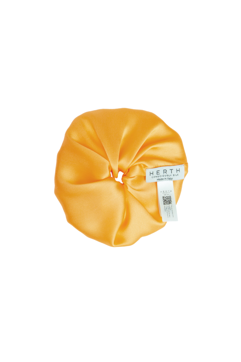 Edi scrunchie in mango organic silk — vibrant and sustainable hair accessory by HERTH.