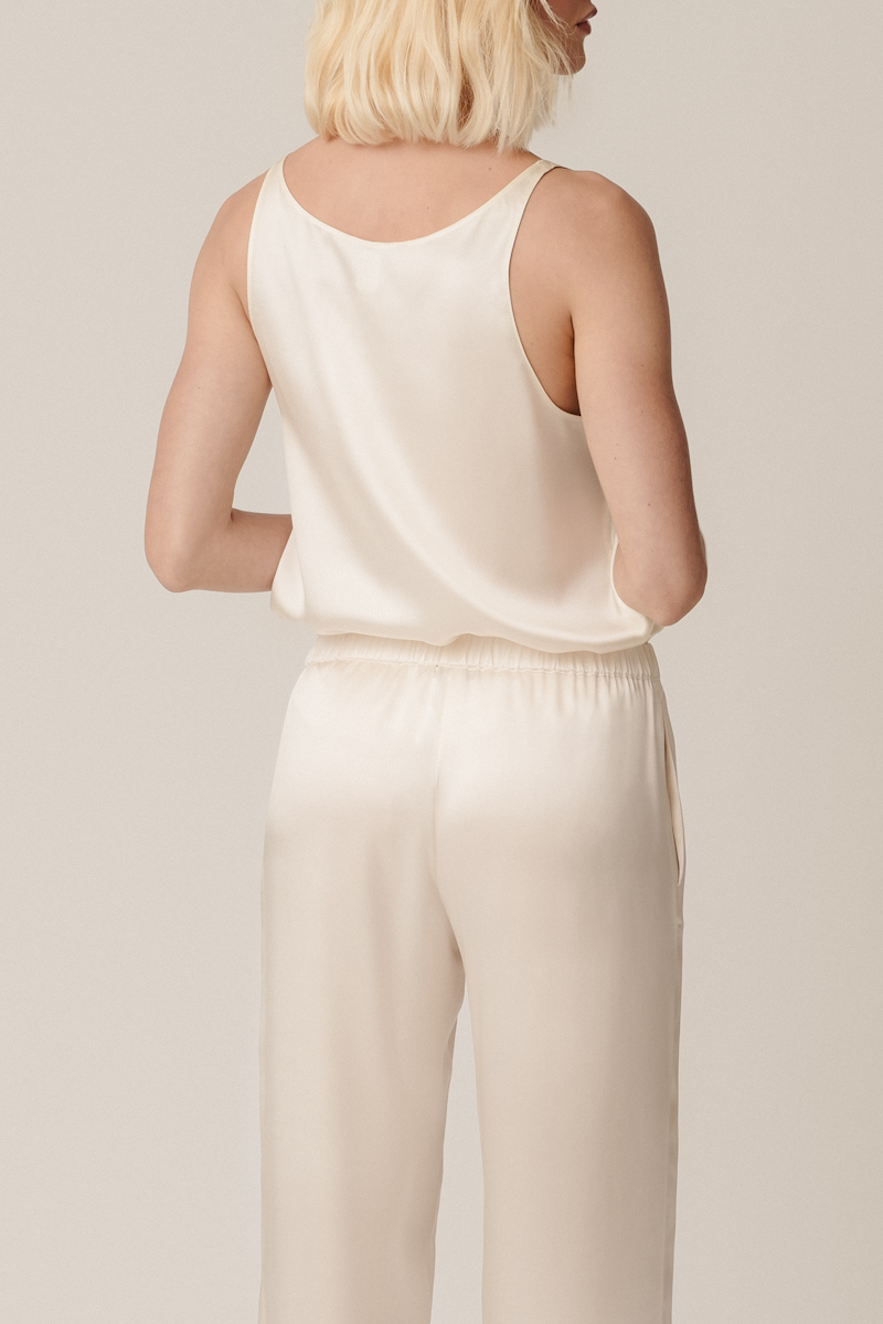 Back view of Else silk tank top and Zeno trousers in almond — consciously made organic silk womenswear essentials by HERTH.
