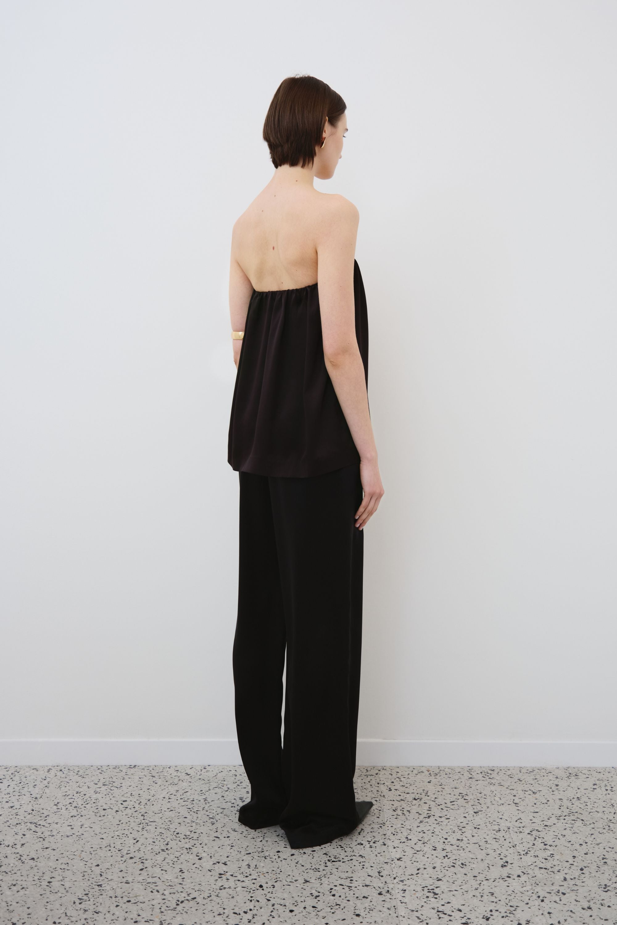 Back view of black organic silk top and trousers set, Gala top and Joy trousers made in Italy