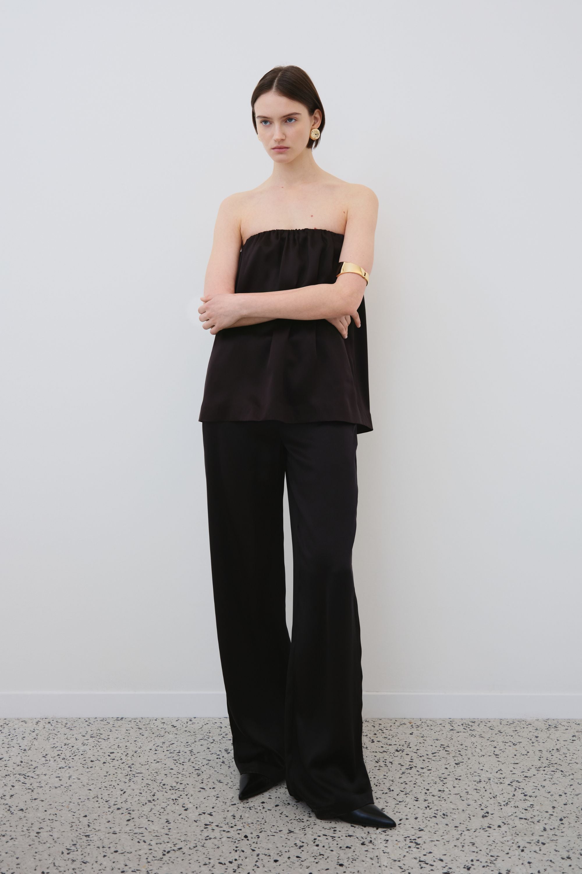 Model wearing black organic silk top and trousers set, Gala top and Joy trousers made in Italy, front view