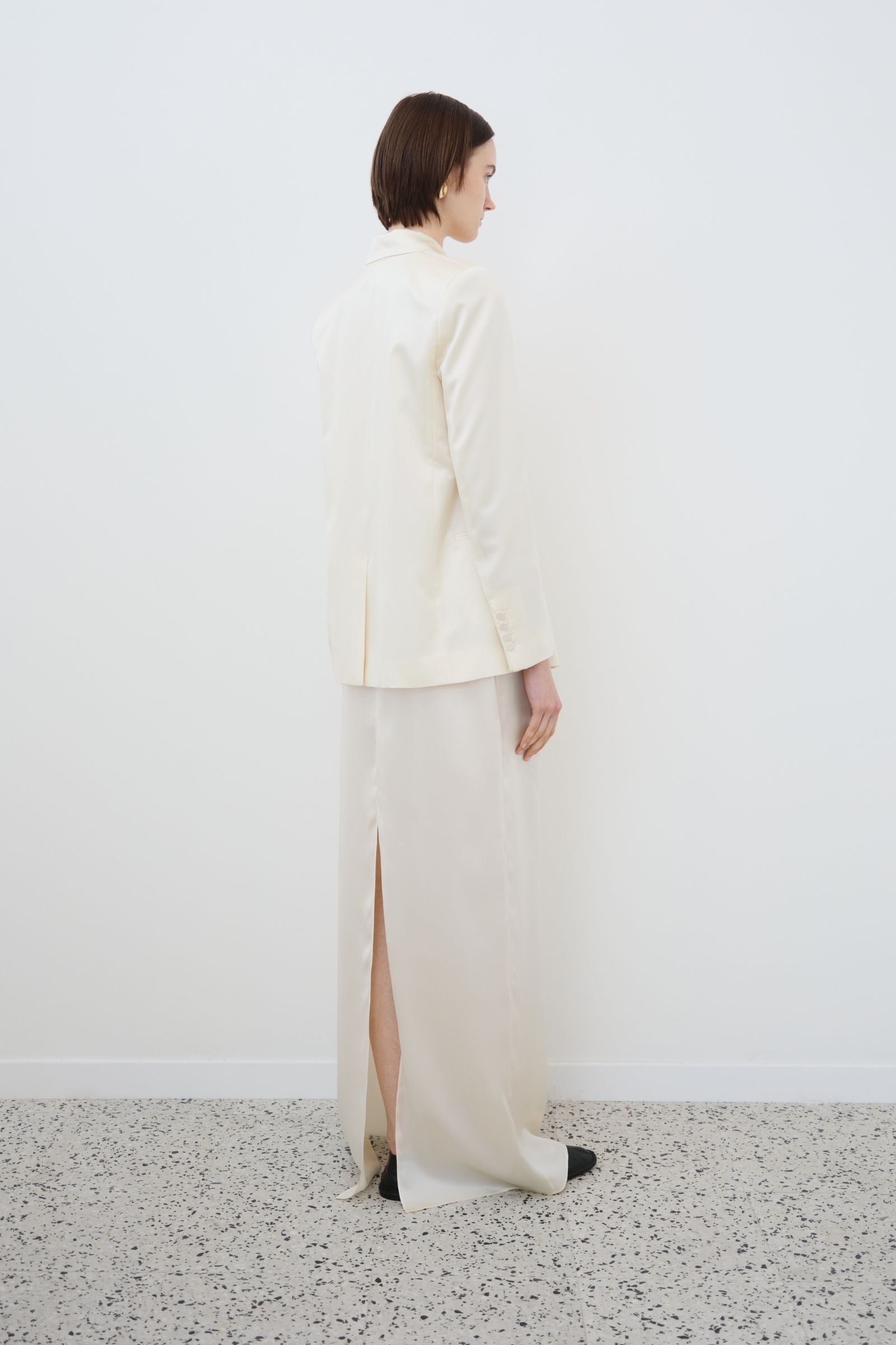 Almond silk blazer and skirt set side view, organic silk with soft drape and clean structure, made in Italy