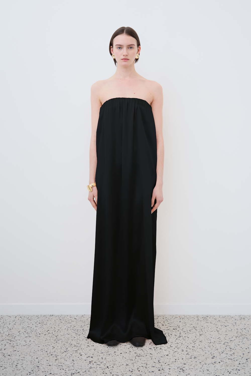 HERTH’s Erin off-shoulder dress in Black — a strapless organic silk gown with a fluid drape and elevated minimal sustainable womenswear.