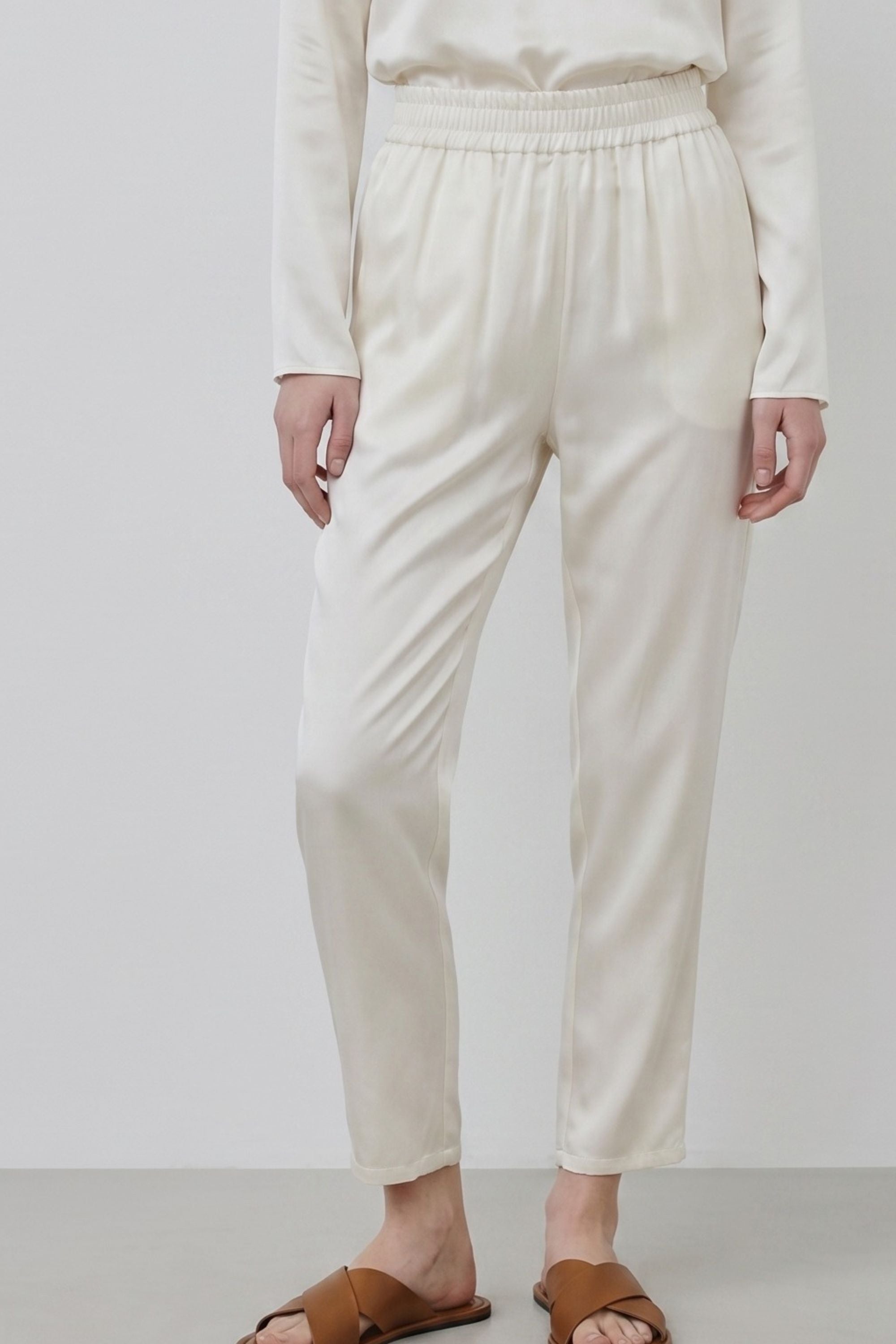 Organic silk Roy trousers in ivory, detail of fabric and waistband, close-up