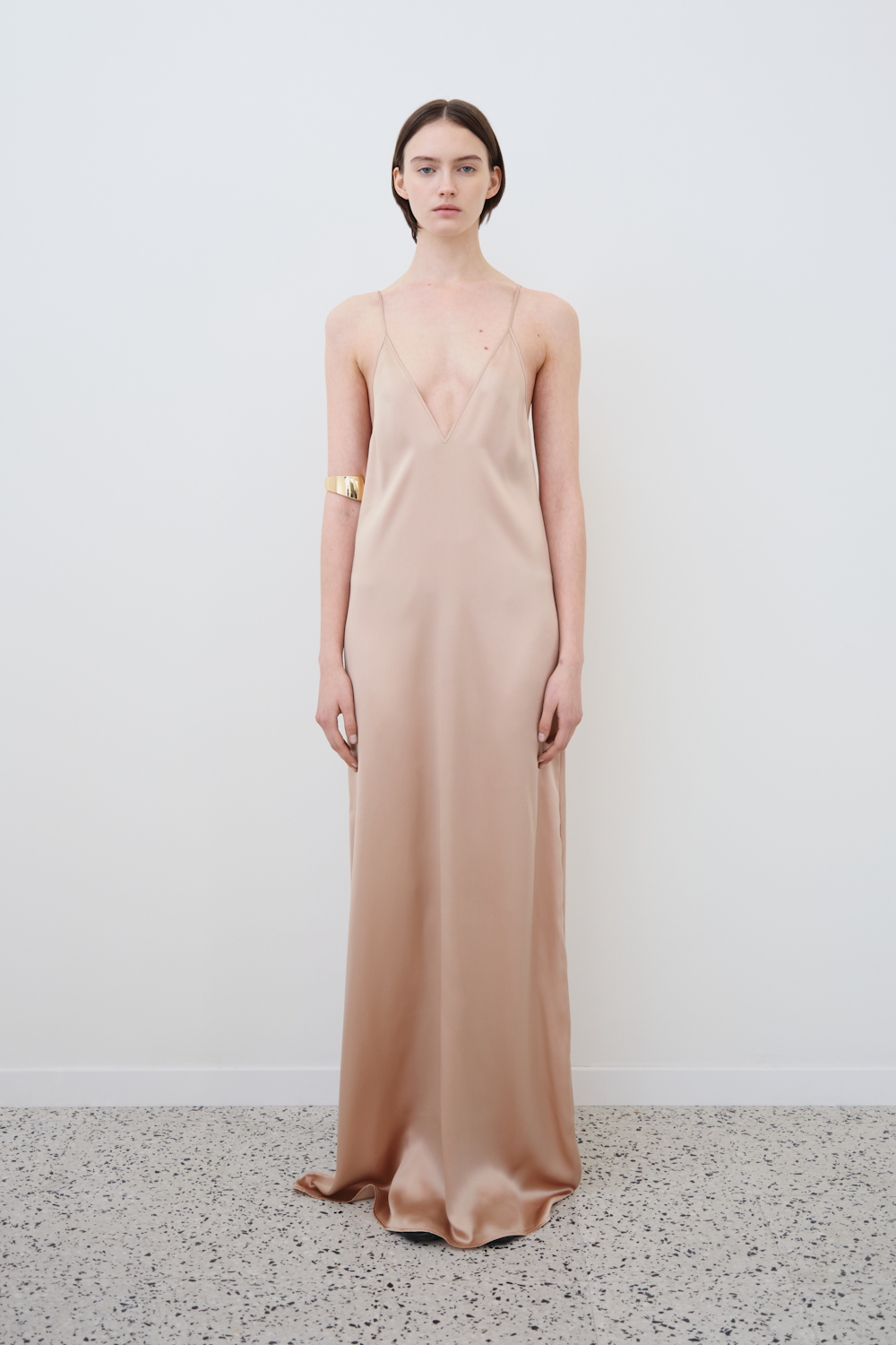 Close-up of the Inez silk slip dress in sand — V neckline and delicate straps crafted from GOTS-certified organic silk, luxury ethical womenswear by HERTH.