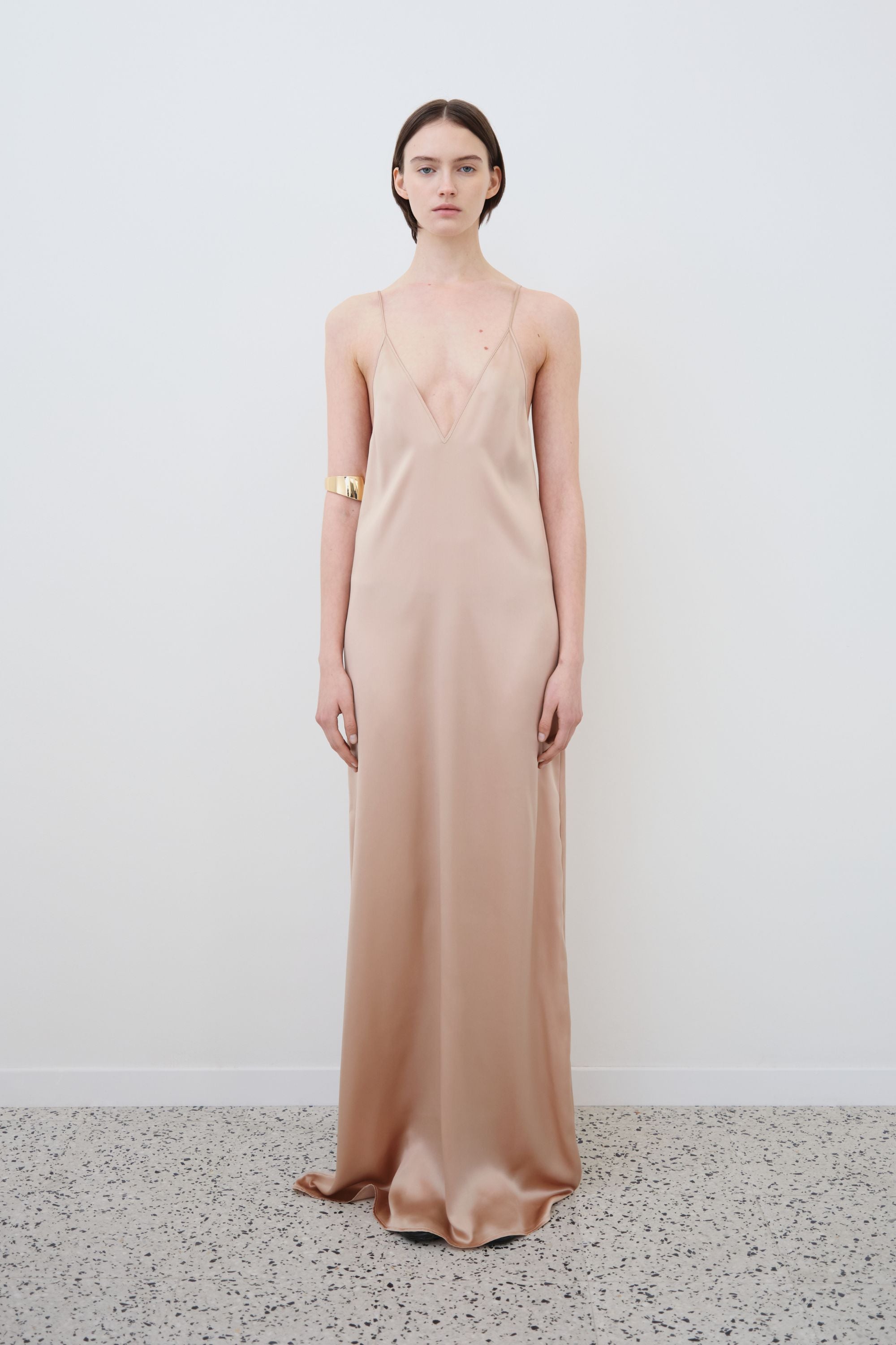 Model wearing organic silk slip dress in sand, Inez dress made in Italy, front view