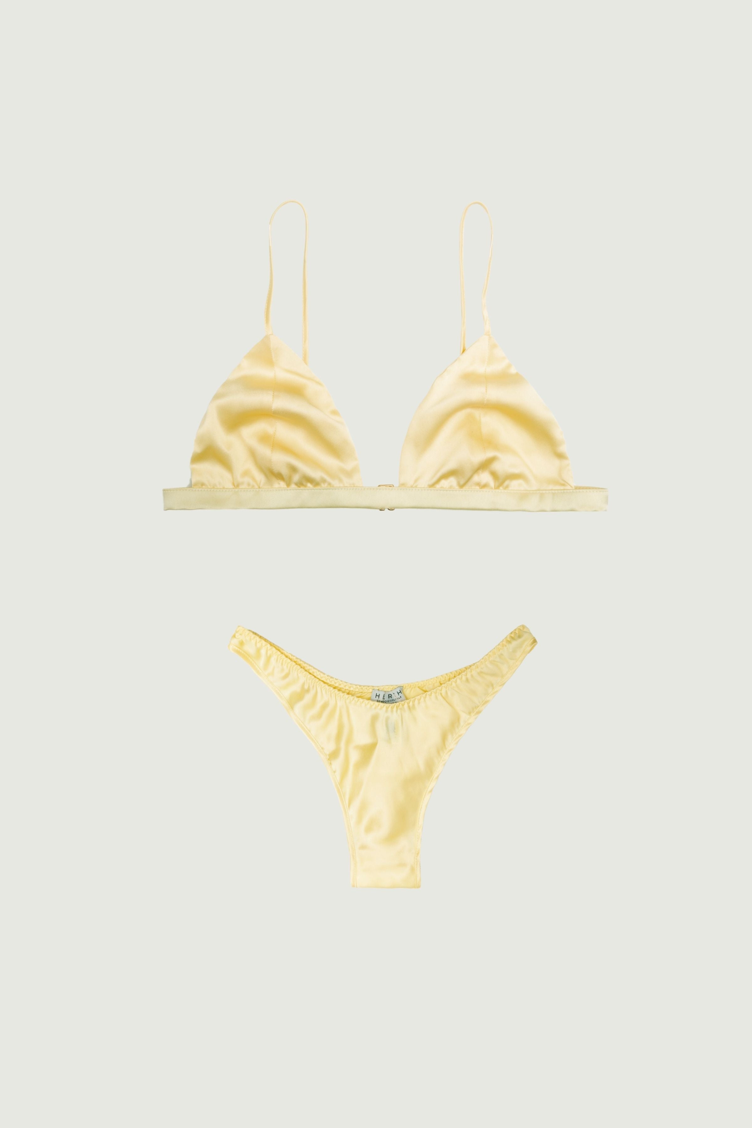 Butter yellow silk lingerie set with triangle bra and high-cut panty, front view highlighting soft sheen and minimal silhouette