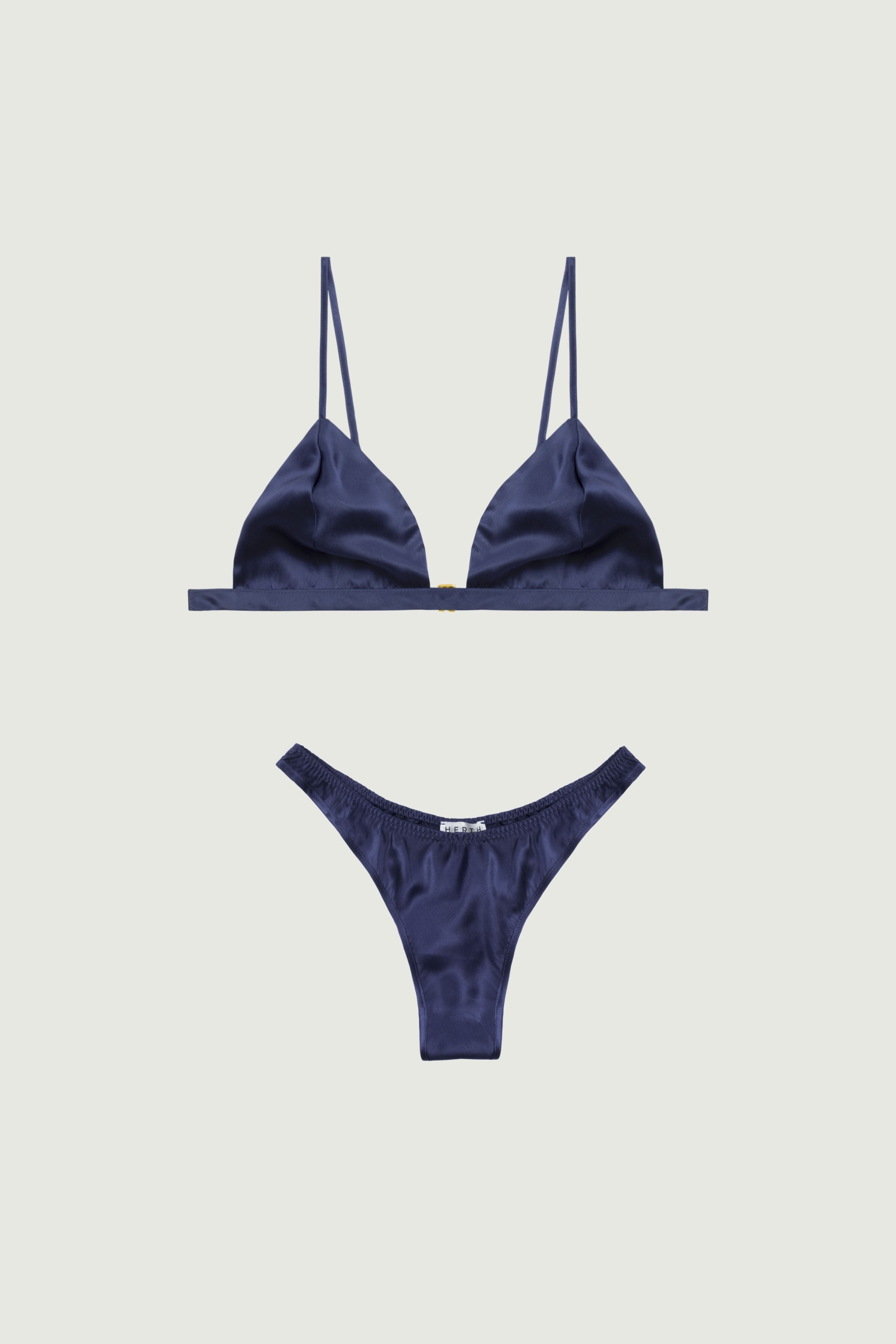 Navy blue silk lingerie set with triangle bra and high-cut panty, front view emphasizing deep tone and smooth satin finish