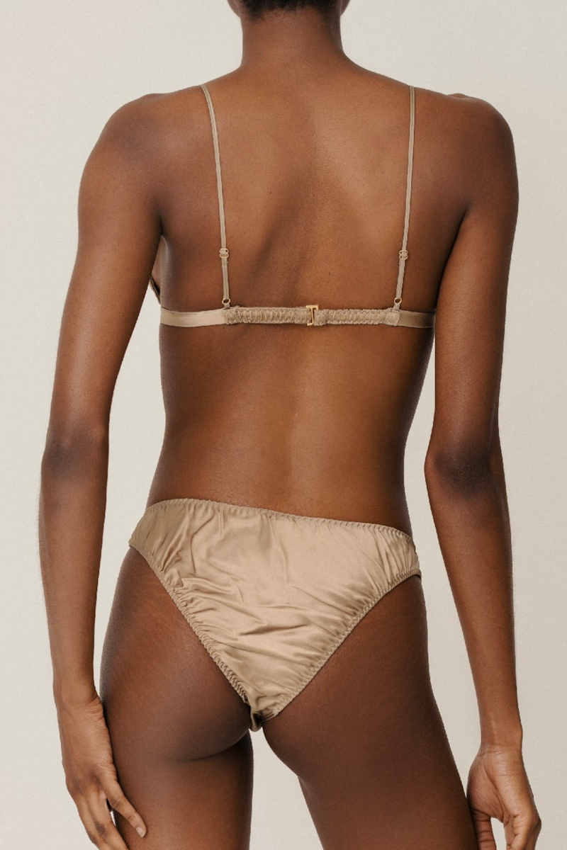 Back view of Ivy triangle bra and Lea mid rise panty in Gold — elegant, breathable organic silk lingerie for summer by HERTH.
