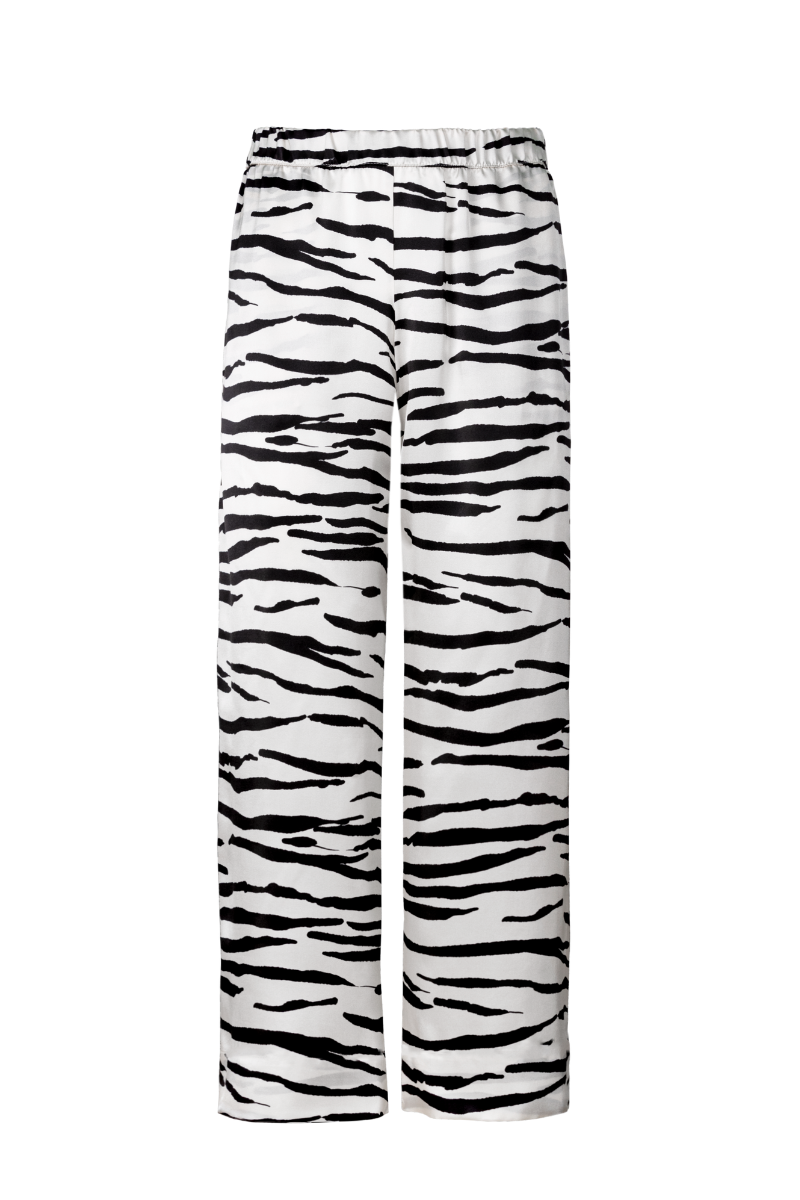 James wide-leg silk trousers in zebra print by HERTH — bold yet refined, made from GOTS-certified organic silk. Luxury ethical womenswear by HERTH.