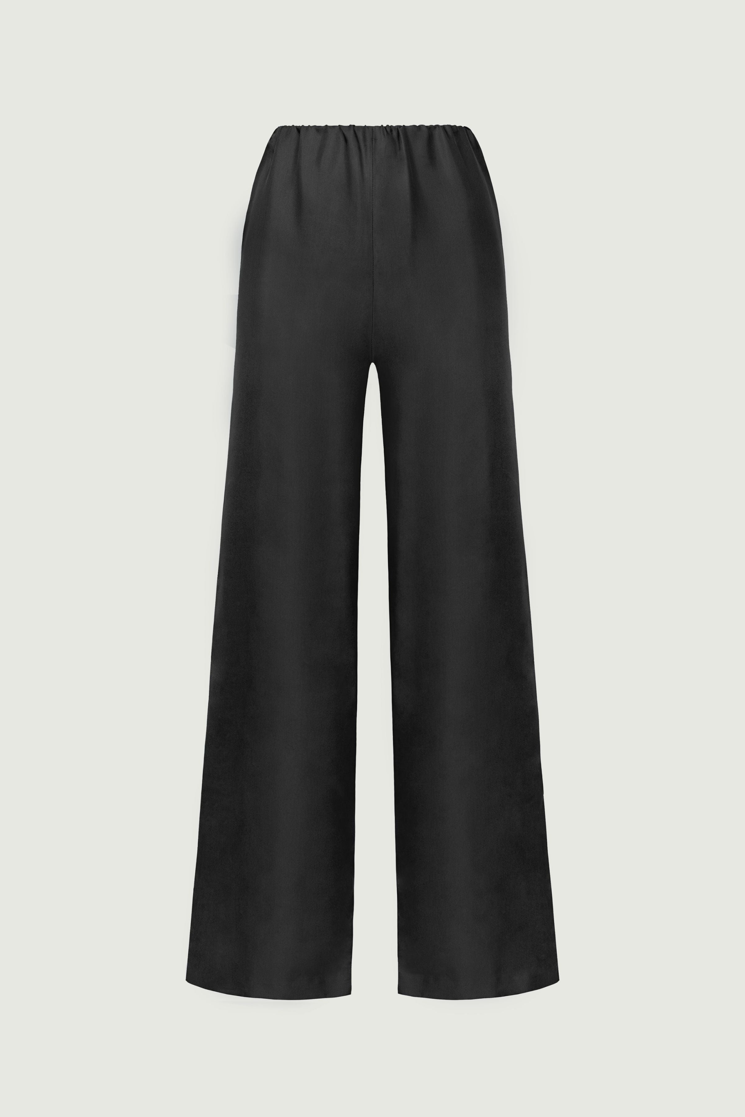 Black organic silk high-rise trousers with wide-leg silhouette and elastic waistband, smooth fluid drape, front view