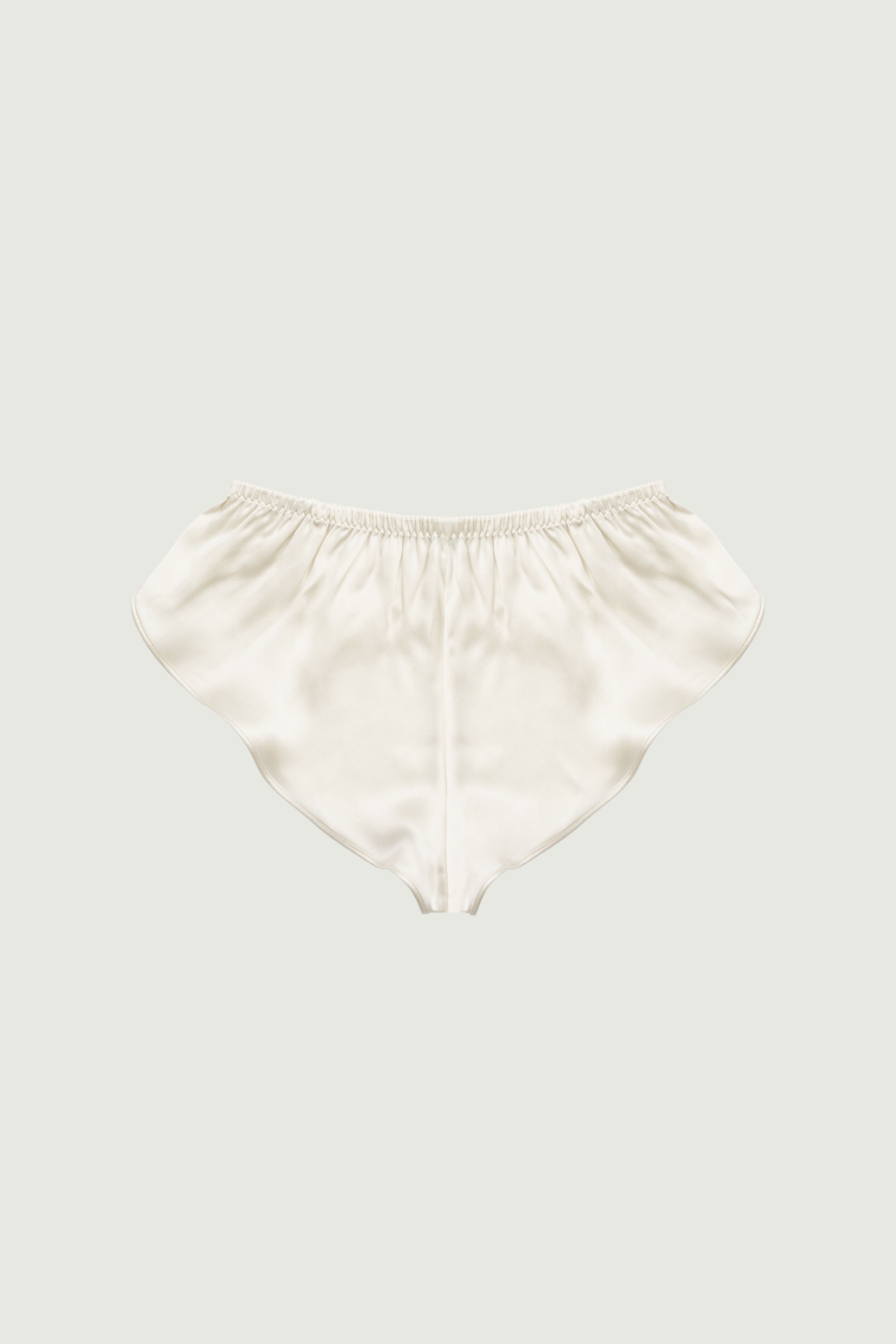 Almond silk culotte shorts, back view showing fluid shape and gathered waistband