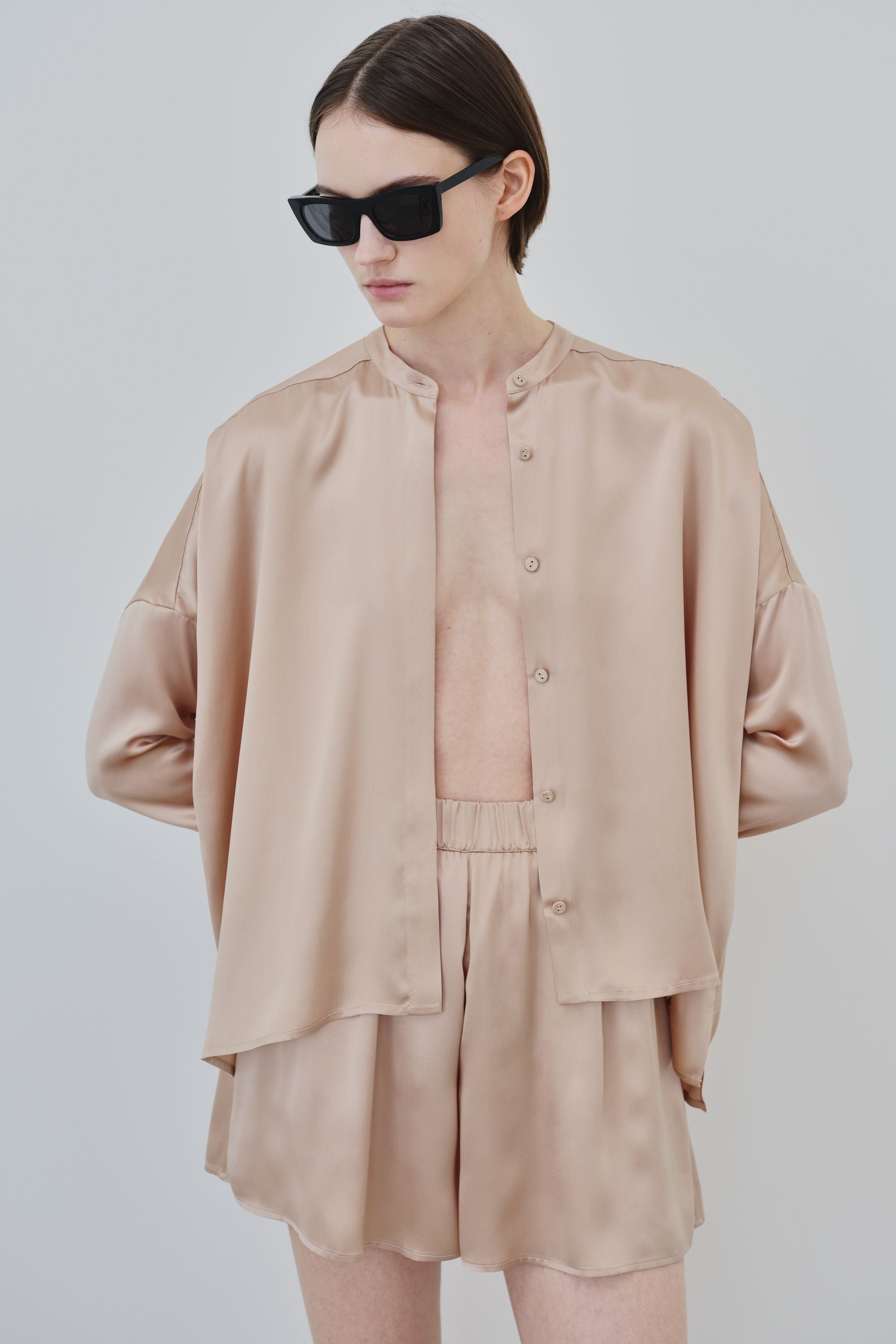 Model wearing organic silk shirt and shorts set, Tess shirt and Hani shorts made in Italy, front view