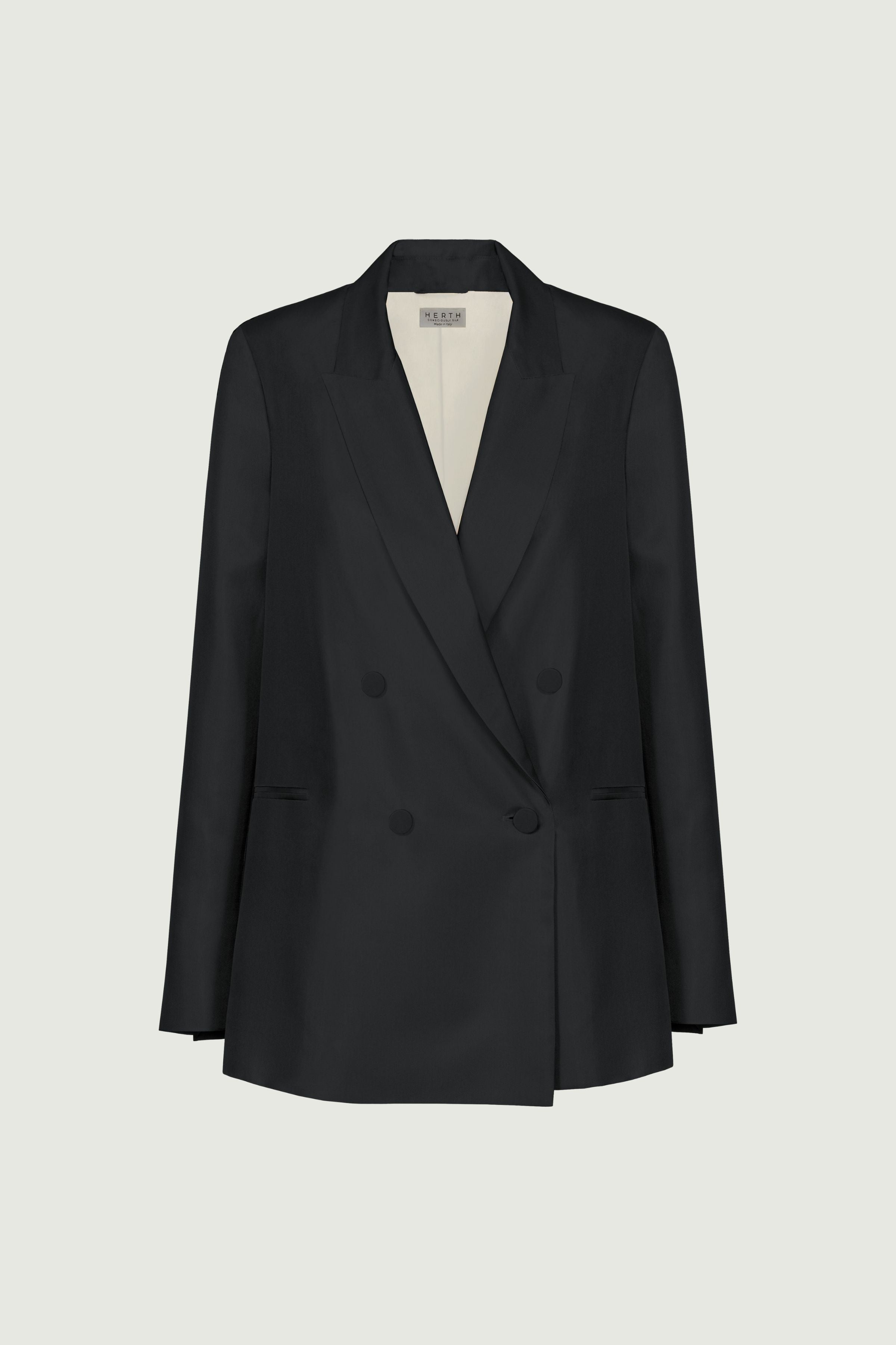 Black double-breasted blazer with strong structured shoulders and defined waist, sharp tailored silhouette designed for a refined formal look, front view