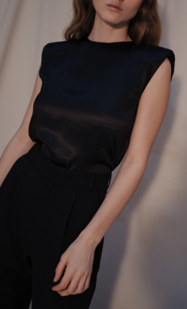 Amy bodysuit in black organic silk — elevated essential with strong silhouette and effortless elegance, ethical womenswear crafted in Italy by HERTH.