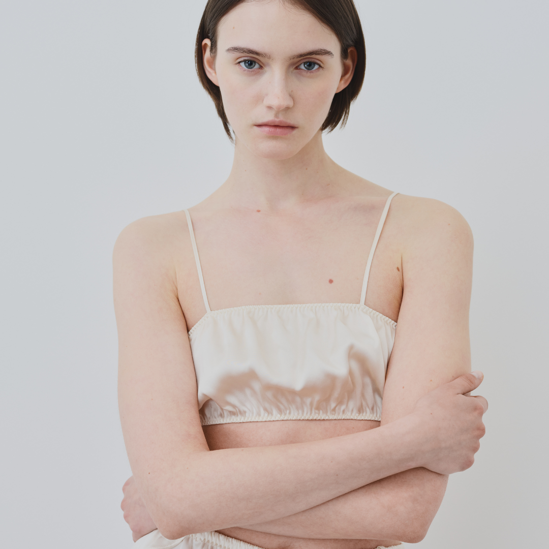 Model wearing sustainable organic silk lingerie from HERTH — elegant and eco-conscious lingerie collection