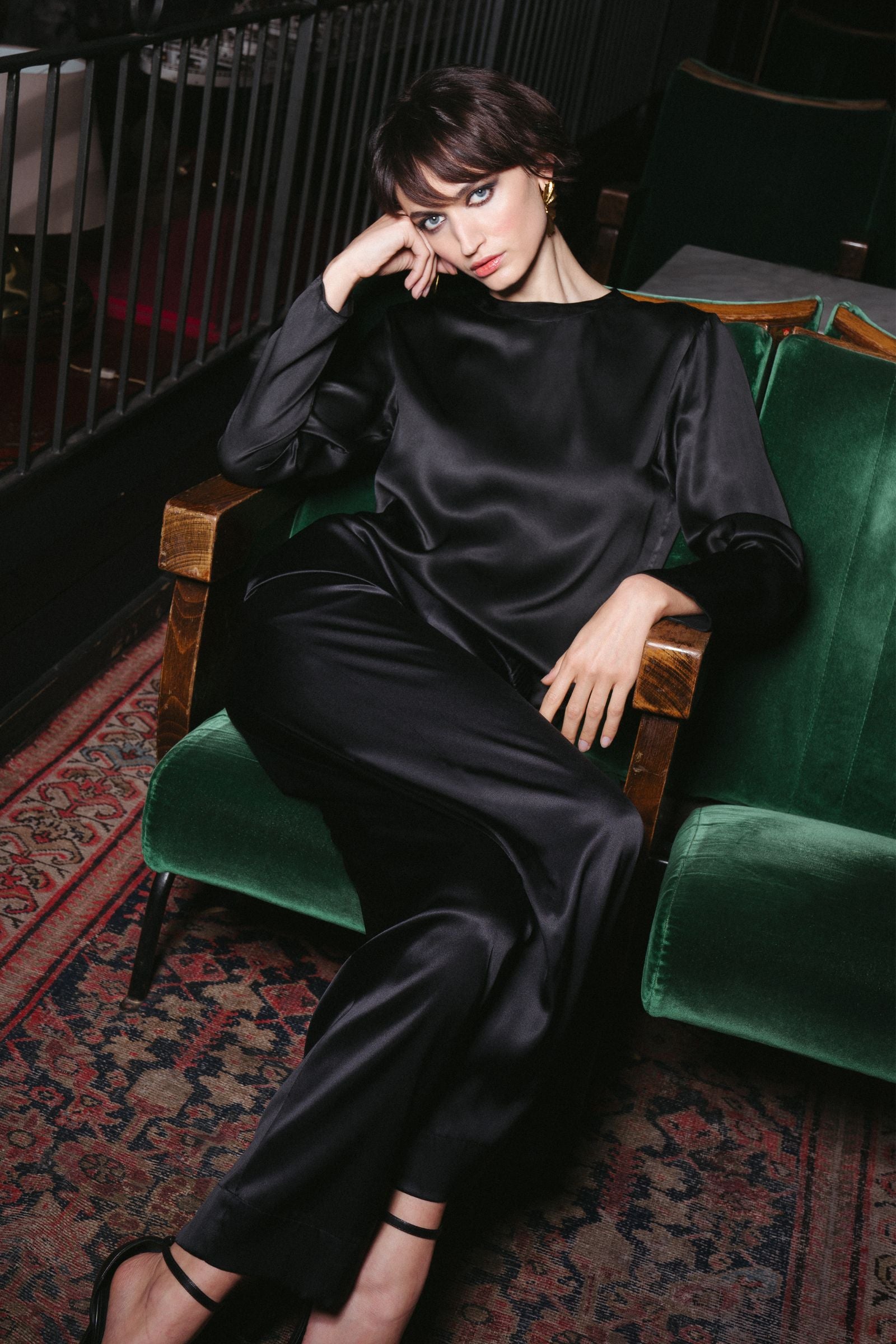 Black organic silk long sleeve top and trousers styled in a relaxed setting with fluid drape and refined silhouette