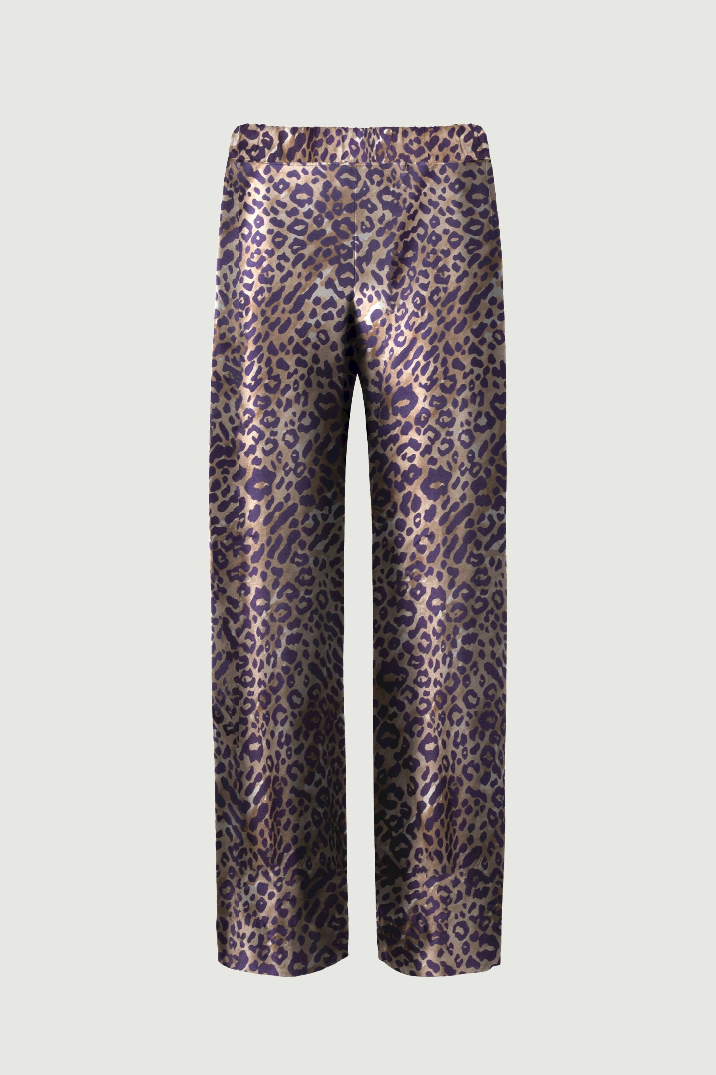 Leopard print organic silk trousers with wide-leg silhouette and elastic waistband, fluid drape and bold pattern, front view