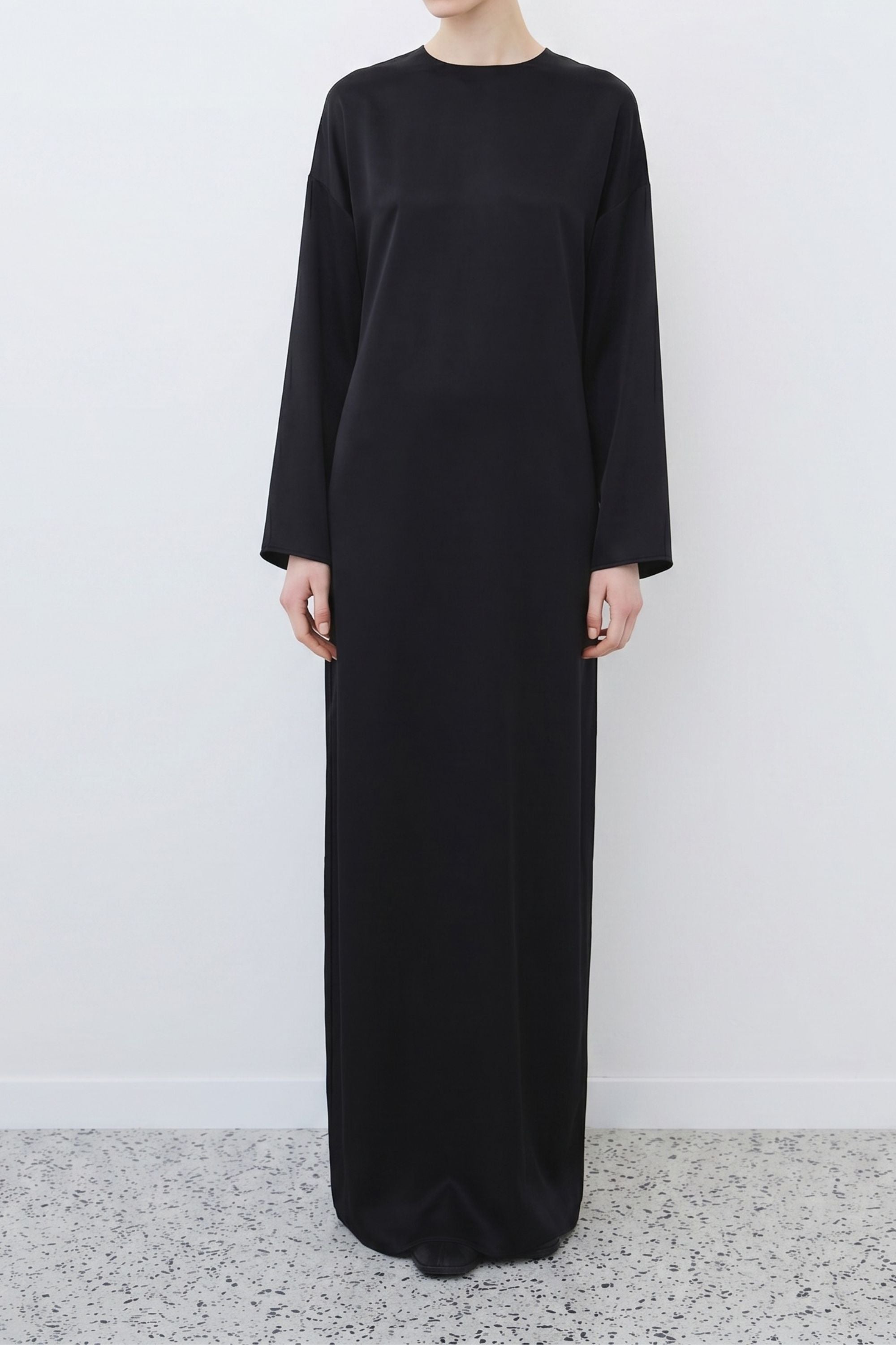 Organic silk long sleeve dress in black, full-length silhouette with fluid drape, made in Italy by HERTH