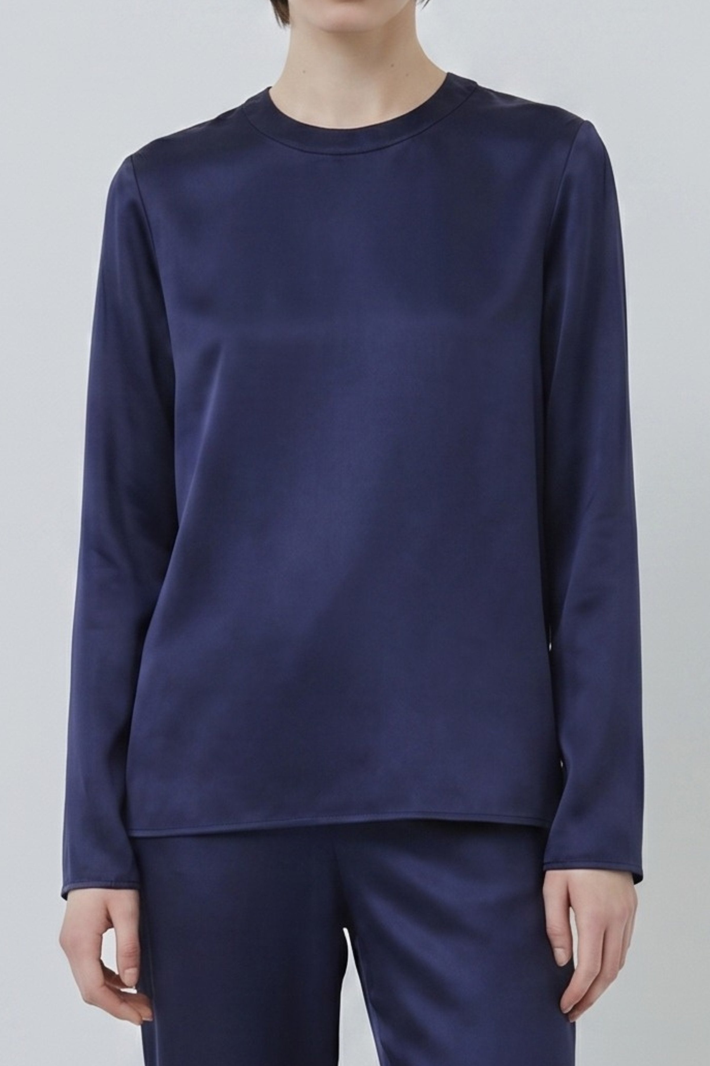 Navy organic silk long sleeve top with relaxed neckline and soft drape