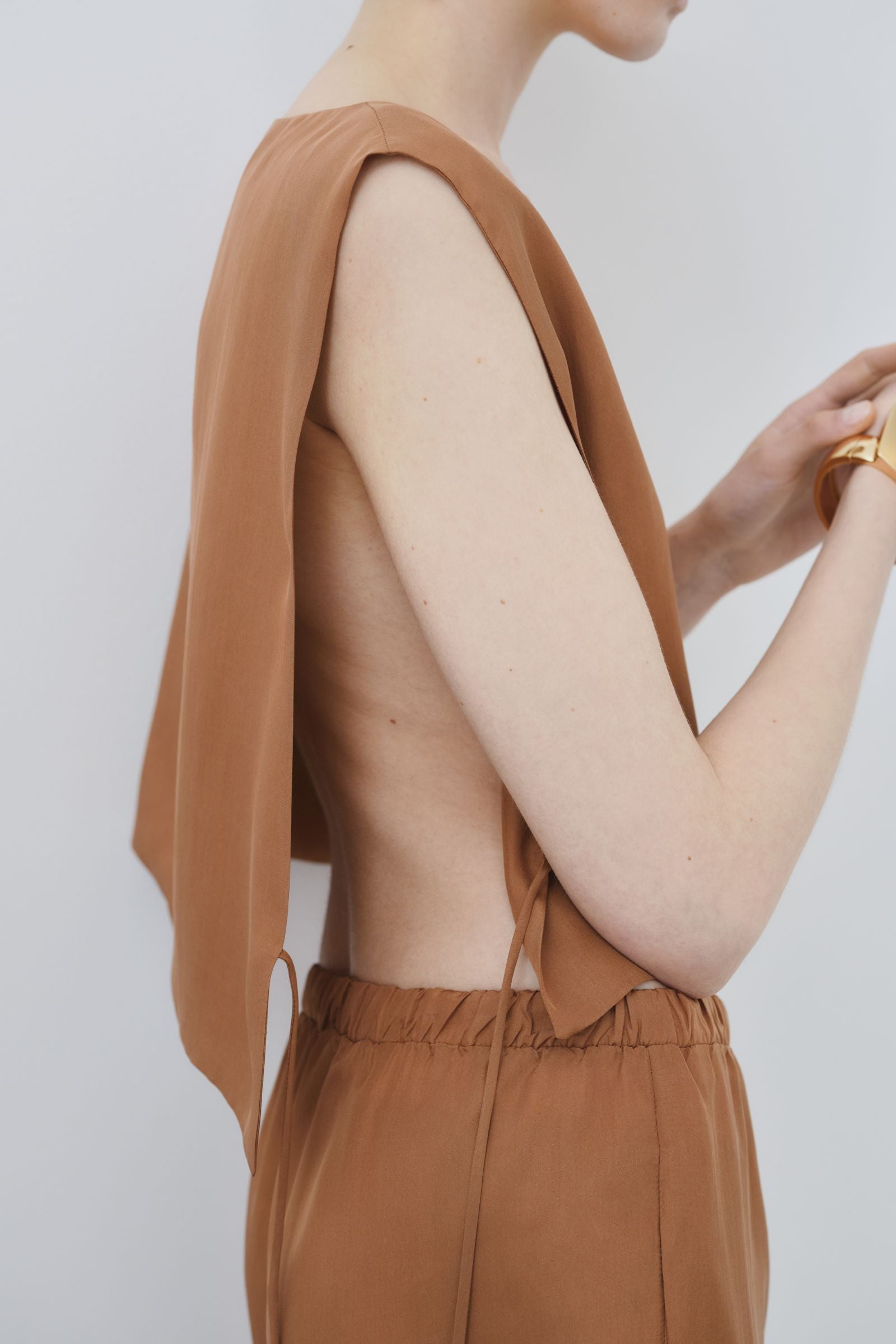 Close-up of organic habotai silk cropped top in earth tone, Ariel top made in Italy