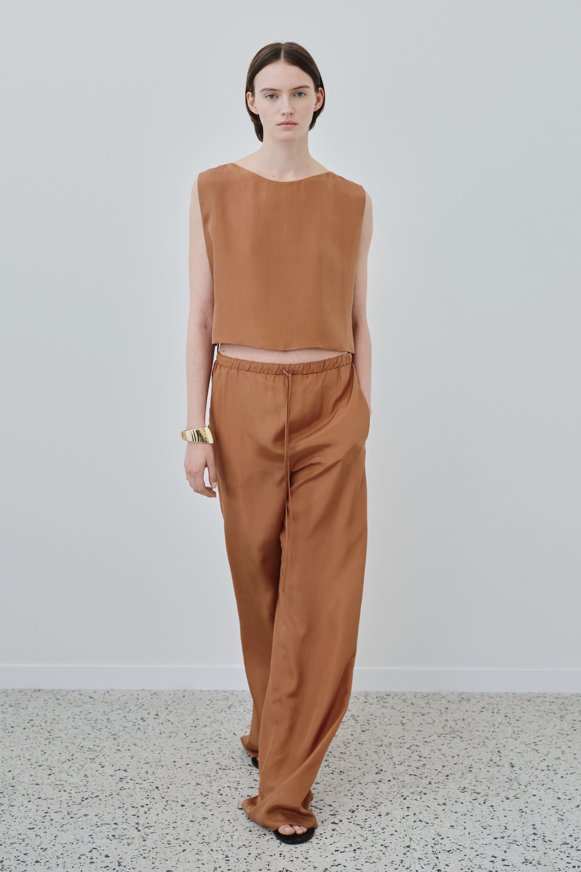 Model wearing organic habotai silk top and trousers set in earth tone, Ariel top and Jody trousers made in Italy, front view