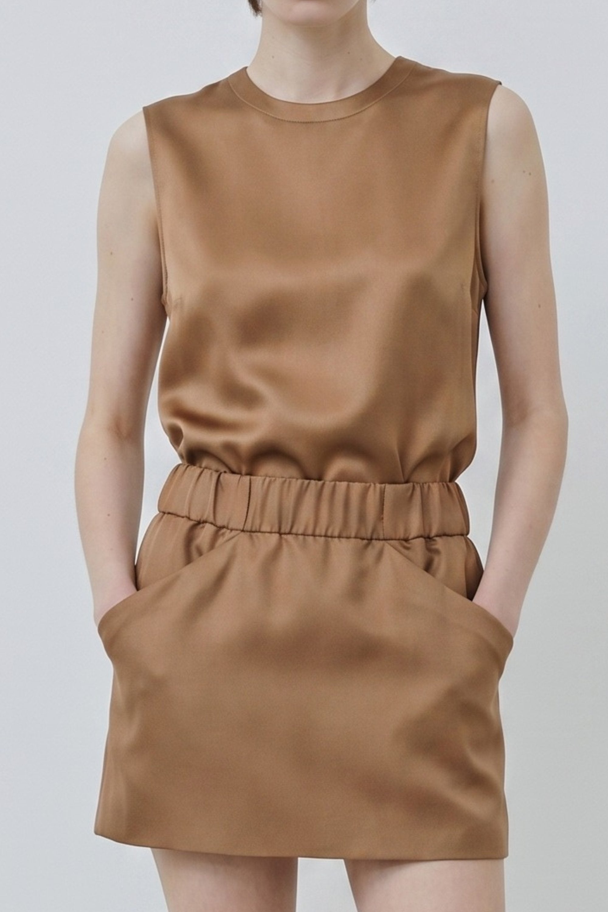 Organic silk Cala top and Nina skirt in camel, close-up showing texture, waistband detail and natural sheen