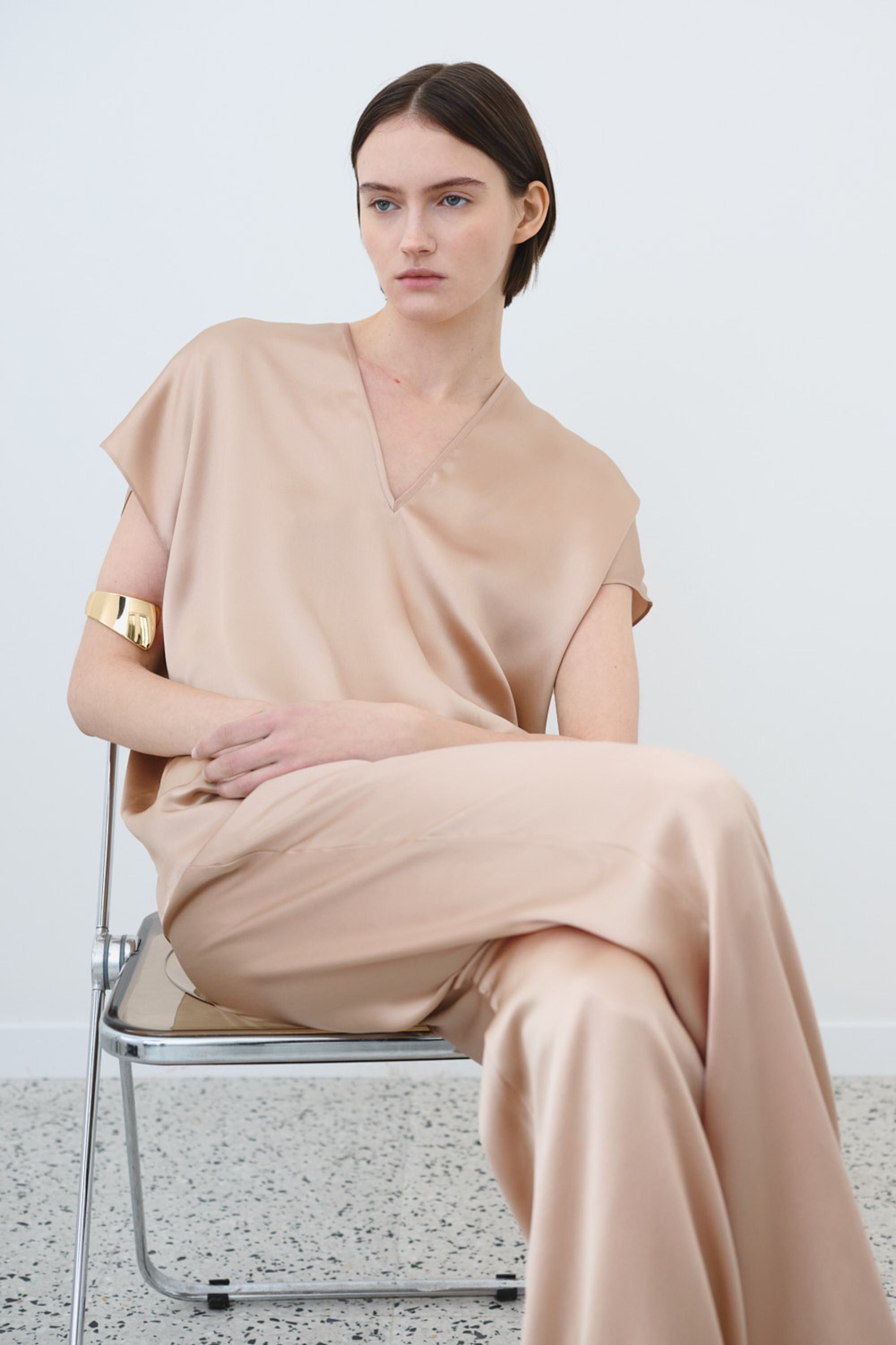 Model wearing organic silk set in sand, Cleo top and James trousers made in Italy, front view