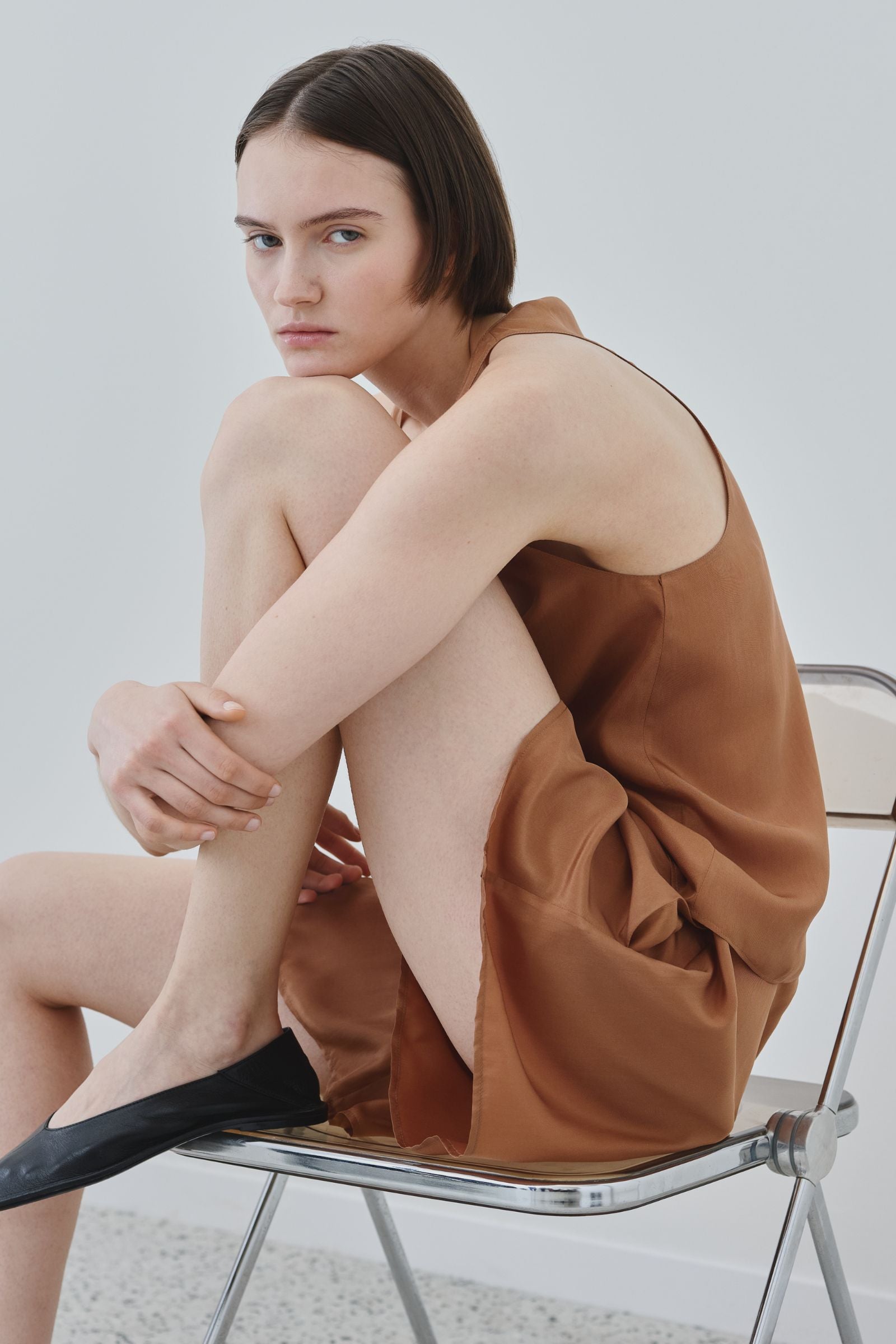 Model wearing organic silk tank top and shorts set in earth tone, Eda tank and Hani shorts made in Italy