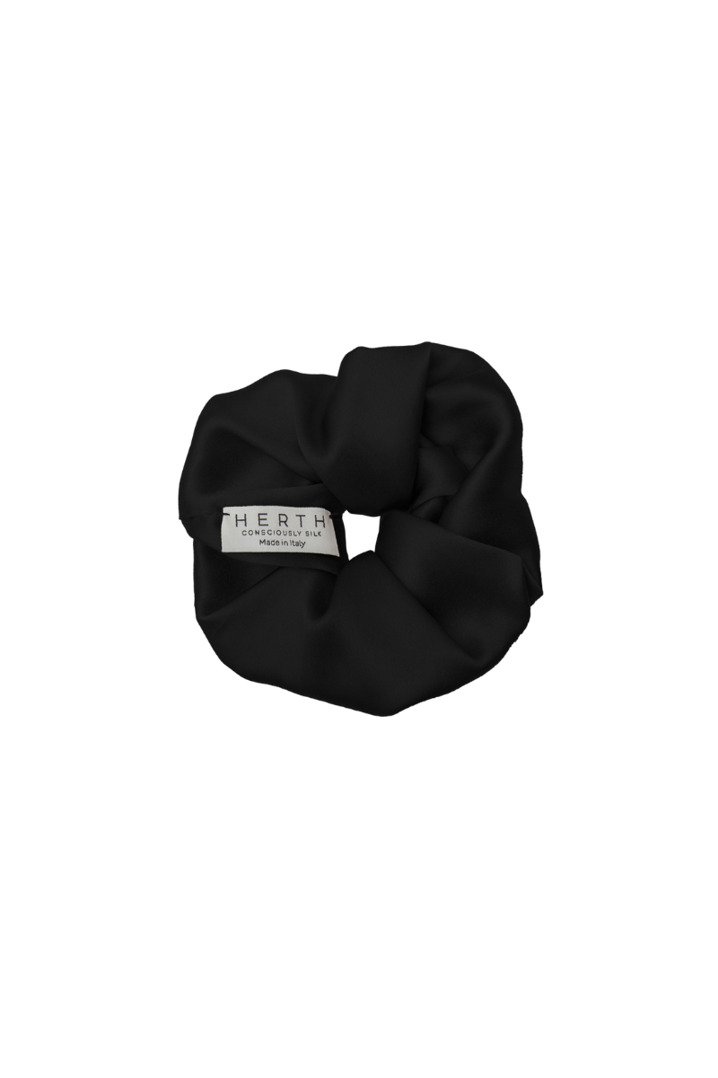 Edi scrunchie in black organic silk — sleek, sustainable hair accessory crafted by HERTH.