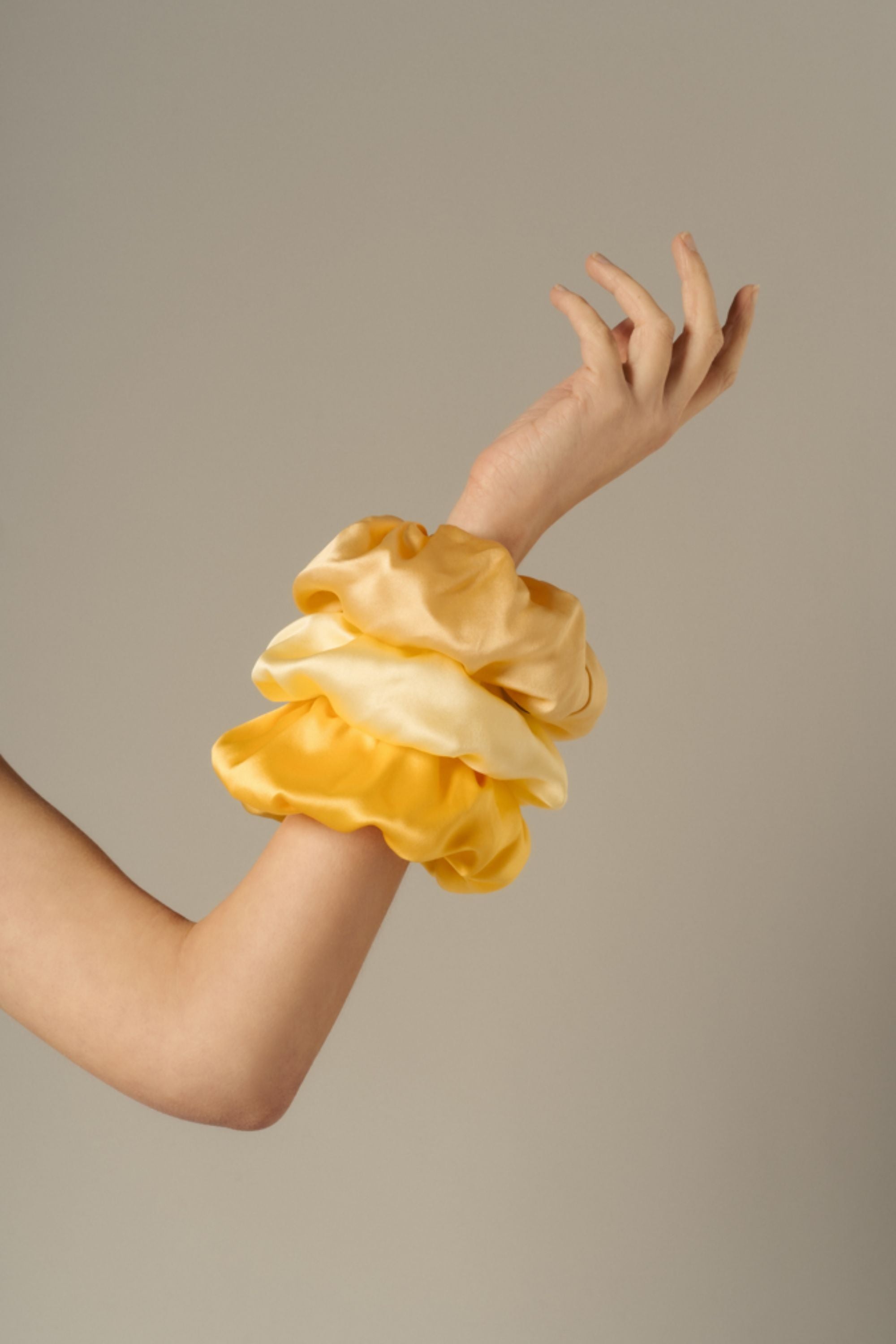 Organic silk scrunchies in desert, butter yellow and mango, made in Italy