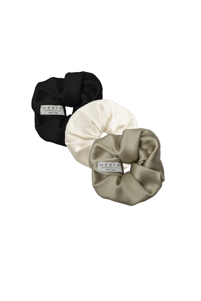 Set of Edi scrunchies in black, almond, and gold sand organic silk — versatile and sustainable silk hair accessories by HERTH.