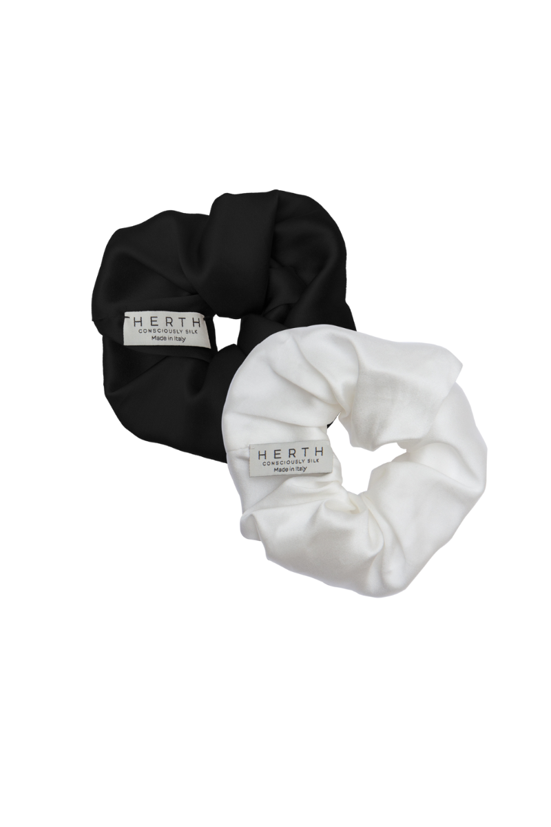 Set of Edi scrunchies in black and ivory organic silk — versatile and sustainable hair accessories by HERTH.