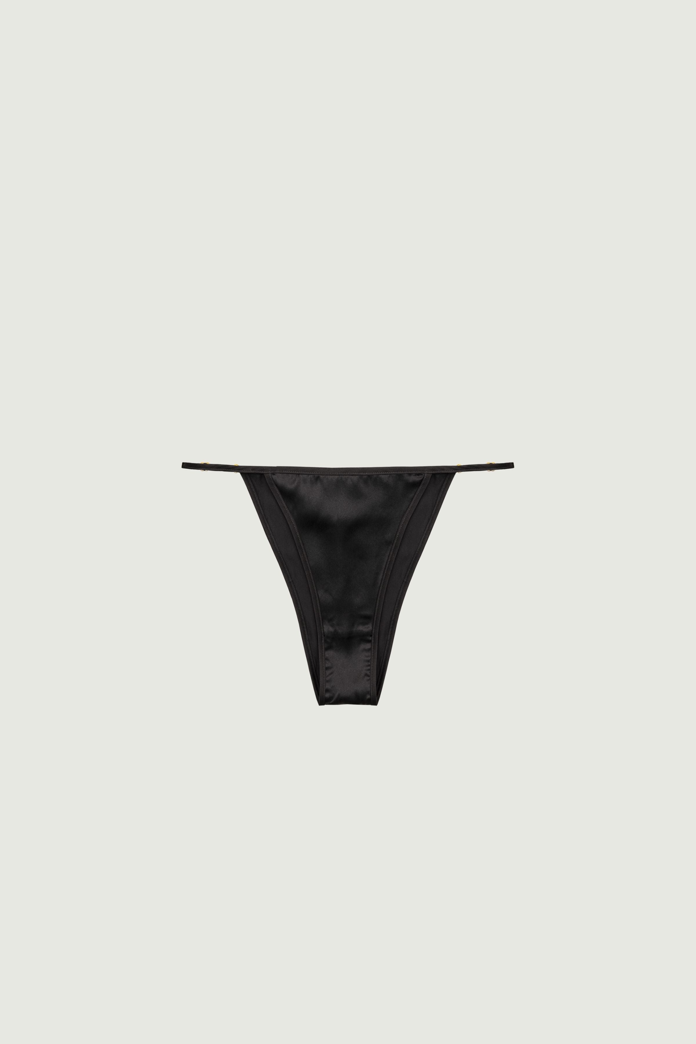 Black silk mid-rise panty with adjustable side straps and gold rings, front view focusing on side detailing and minimal cut