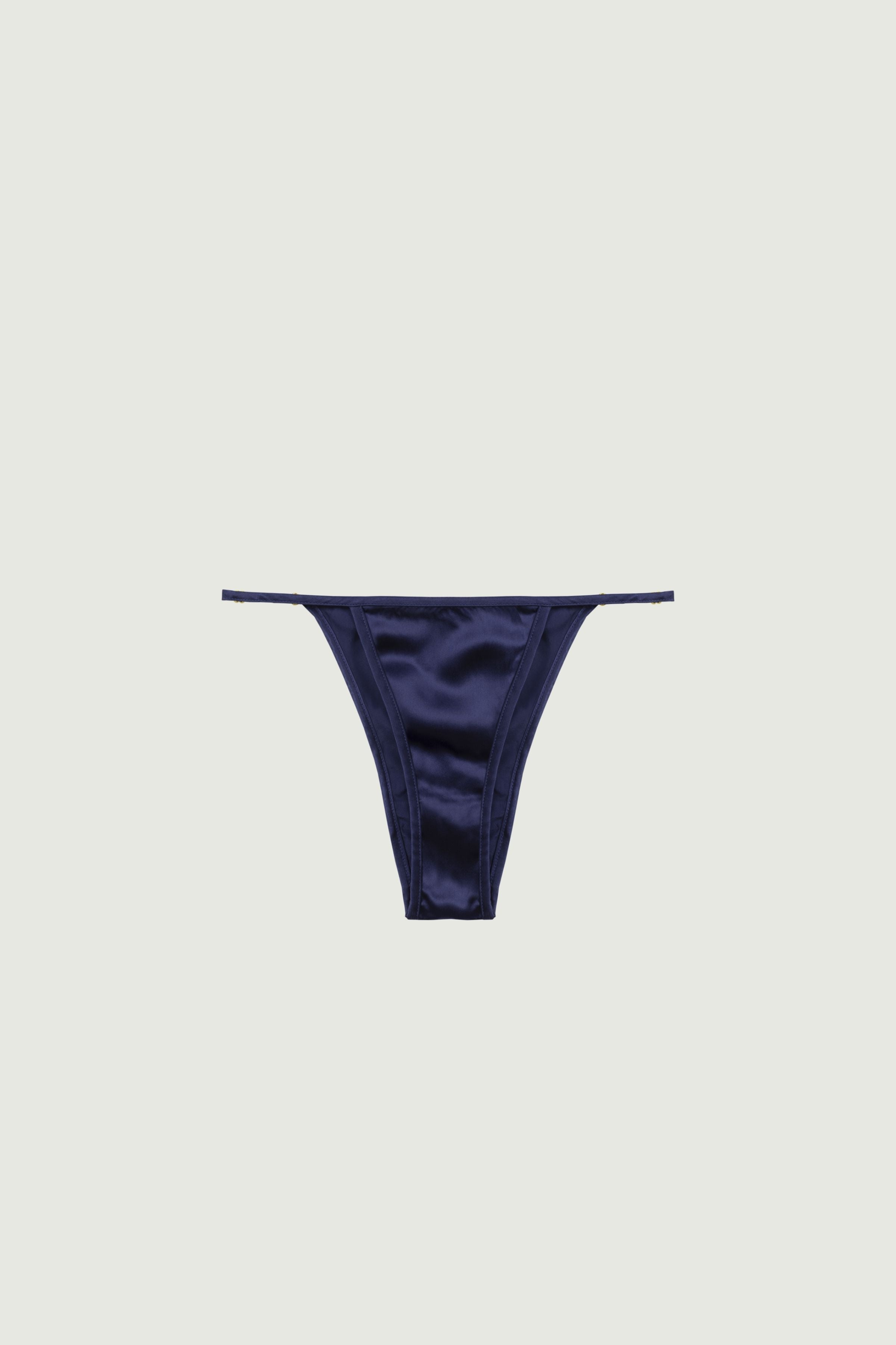 Navy blue silk mid-rise panty with adjustable side straps and gold rings, front view