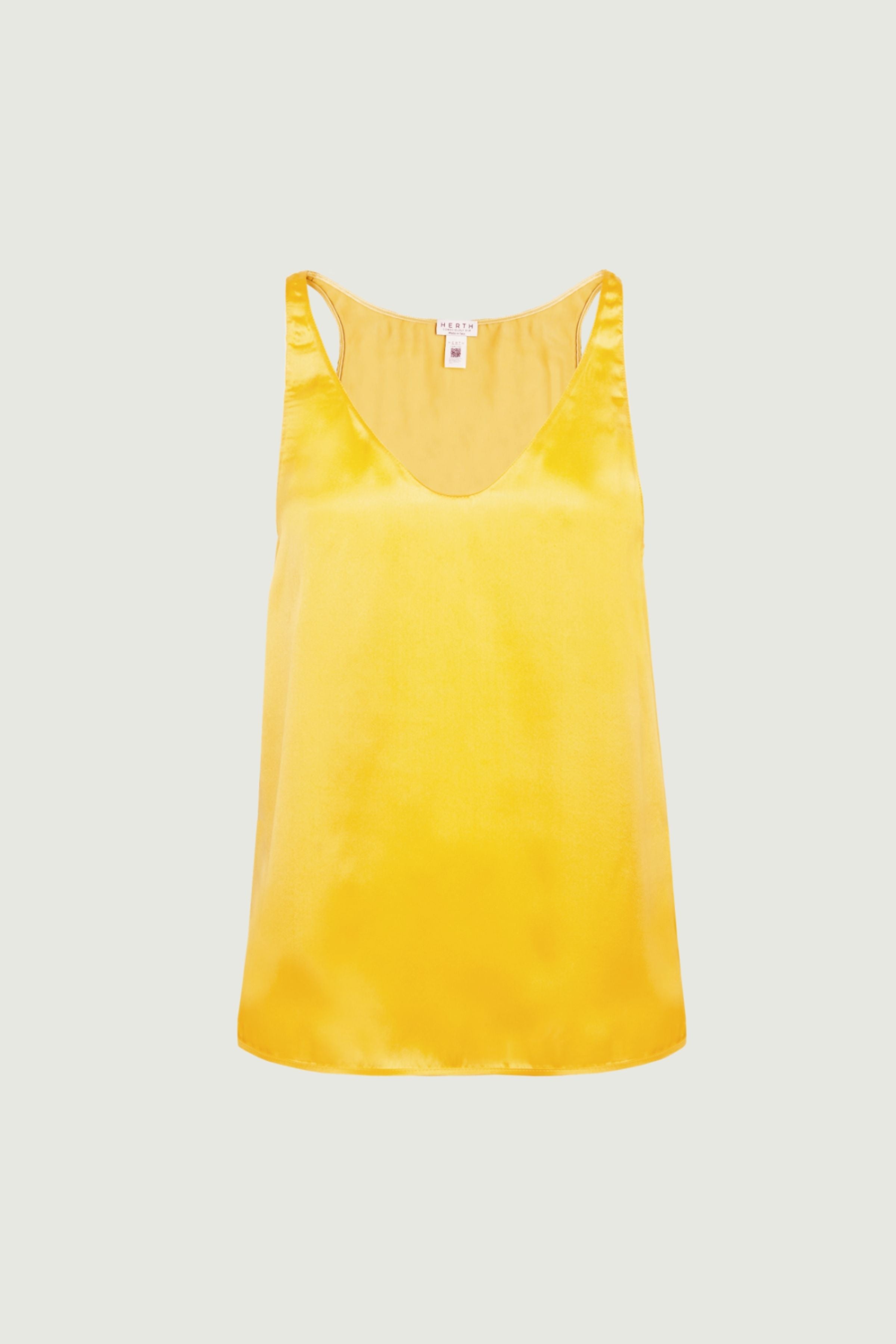 Mango organic silk tank top with vibrant yellow tone and V neckline, fluid drape, minimalist sleeveless design, front view, made in Italy