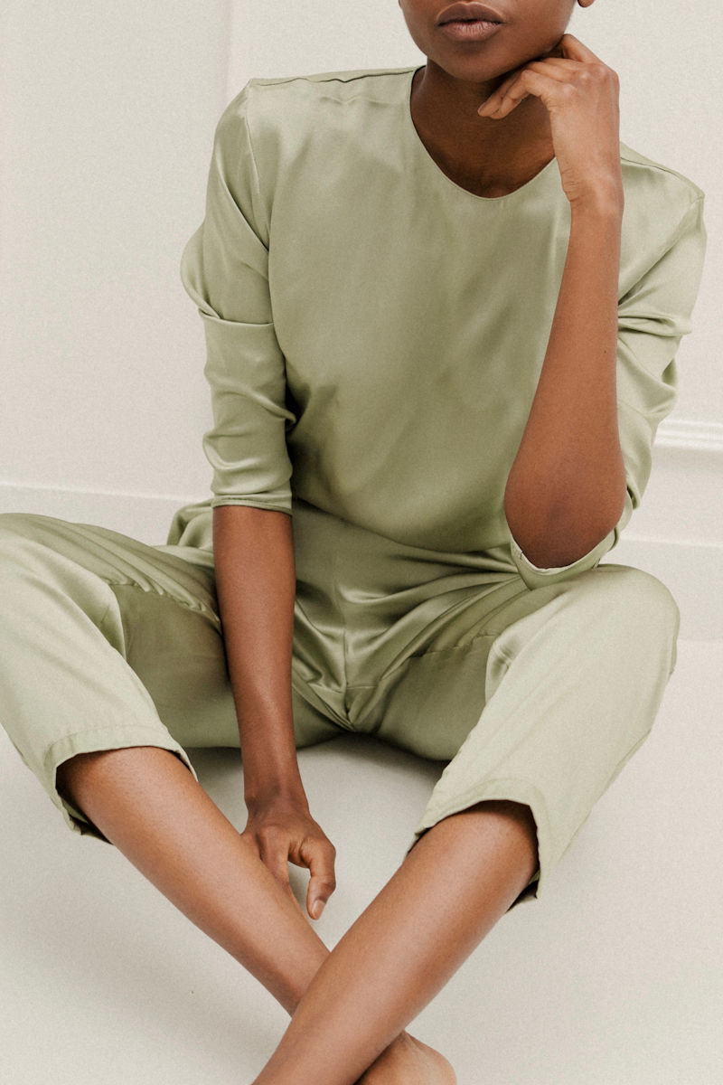 HERTH Ely bodysuit and Roy trousers in Green Tea — an effortlessly chic silk set crafted from GOTS-certified organic silk, designed for refined style and conscious dressing.