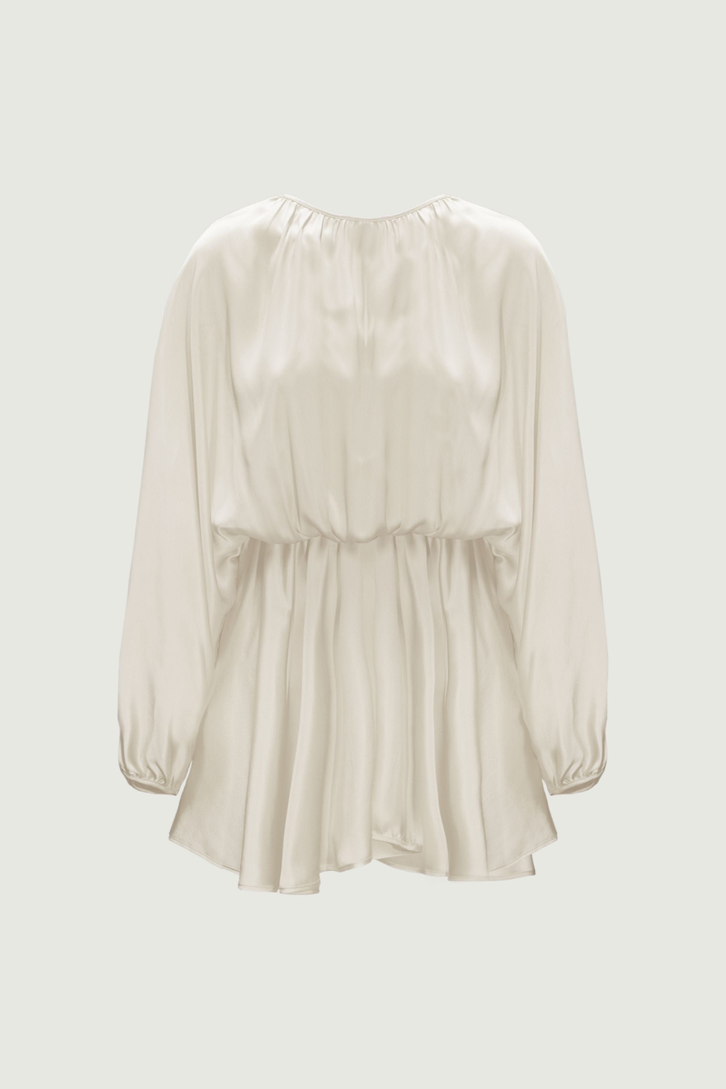 Almond silk mini dress with gathered back and elasticated waist, back view highlighting soft volume and fluid drape