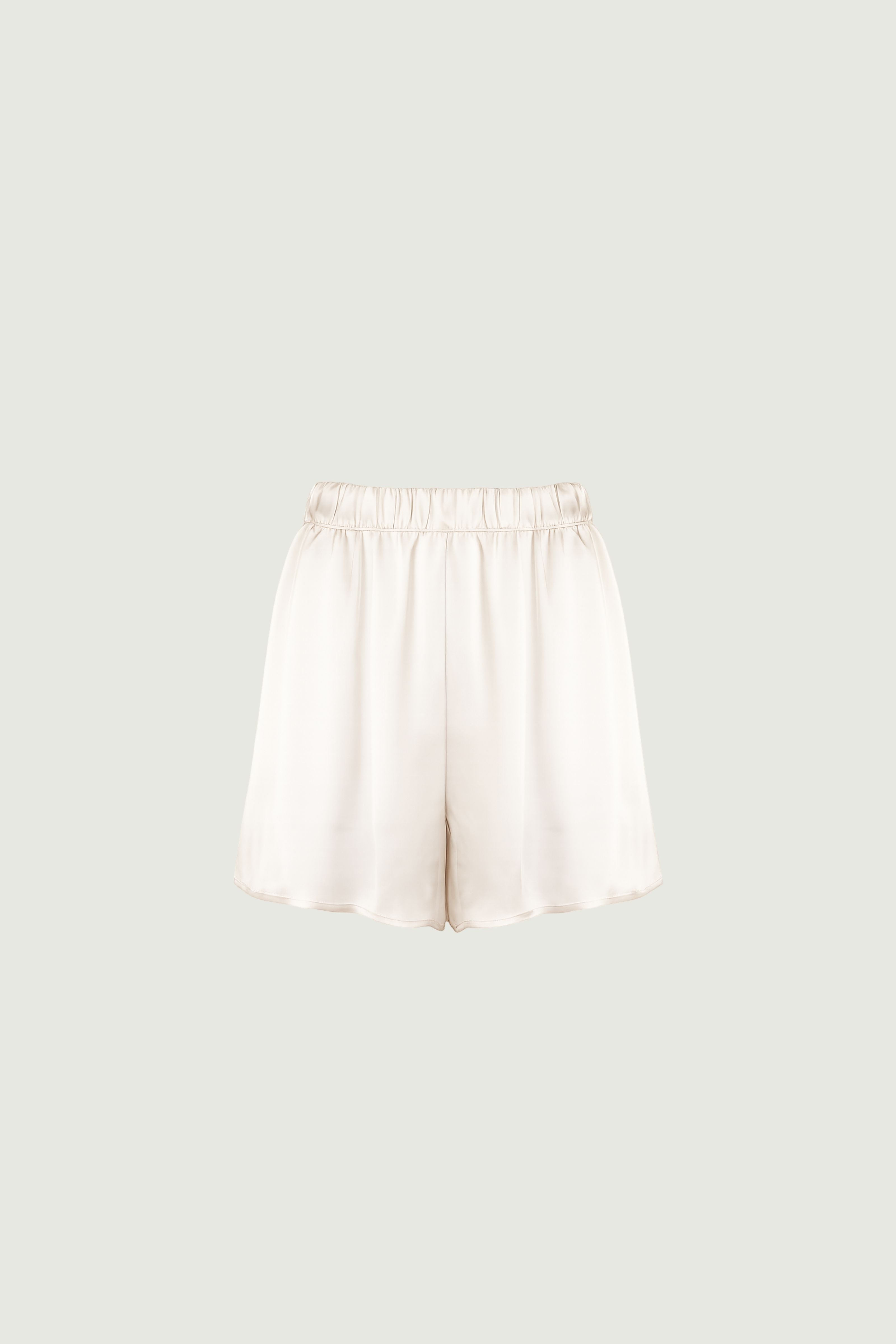 Organic silk wide-leg shorts in almond tone, elastic waistband and side pockets — HERTH