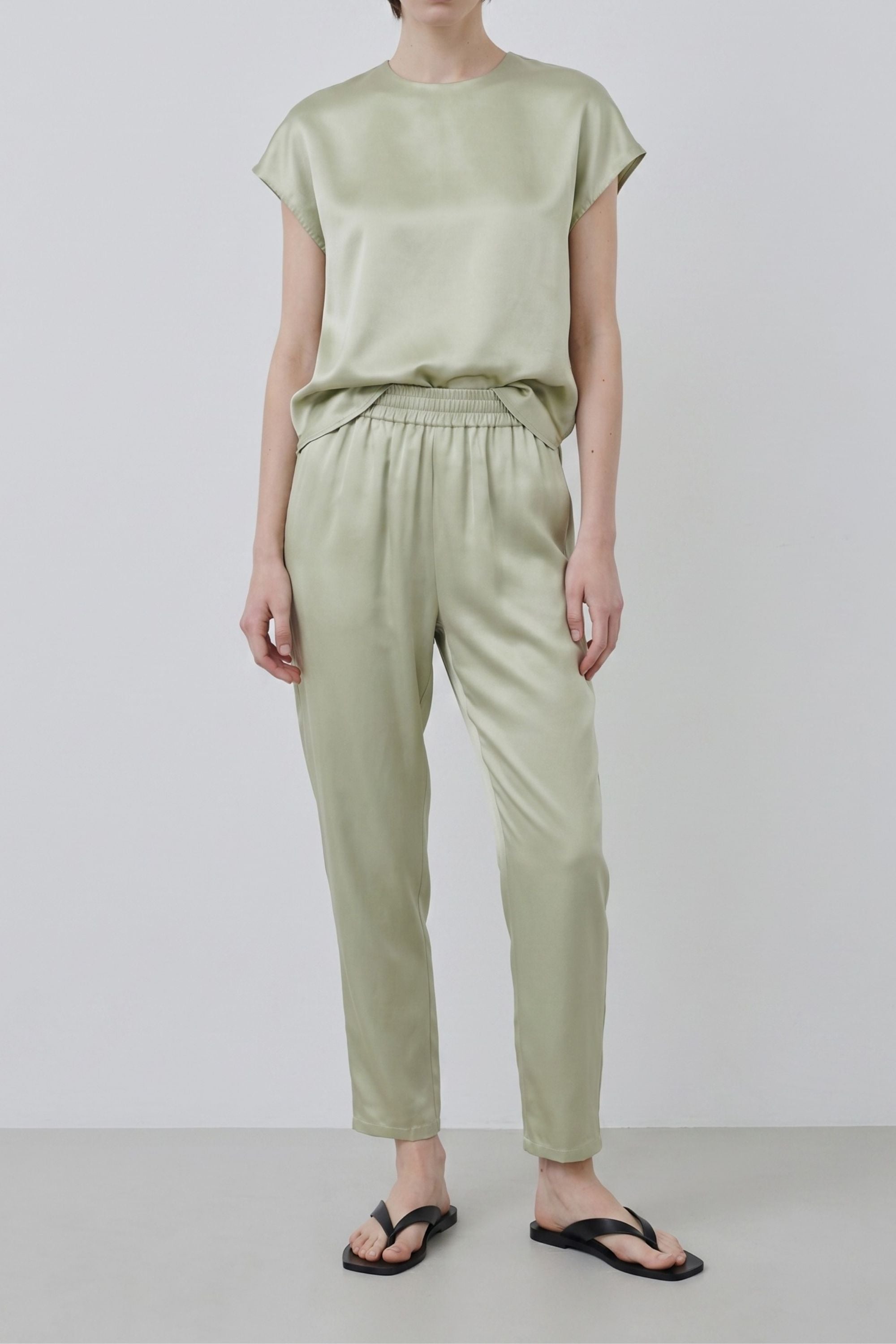 Organic silk Roy trousers in tea, full-length view showing relaxed fit and fluid drape with matching top