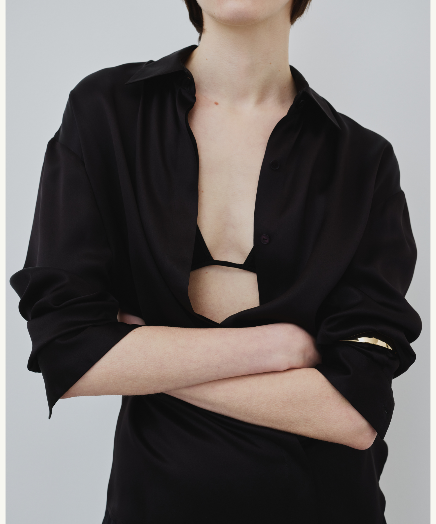 Model wearing HERTH Tilde organic silk shirt in black styled with Keri triangle bra, sustainable lingerie and luxury silk essentials.