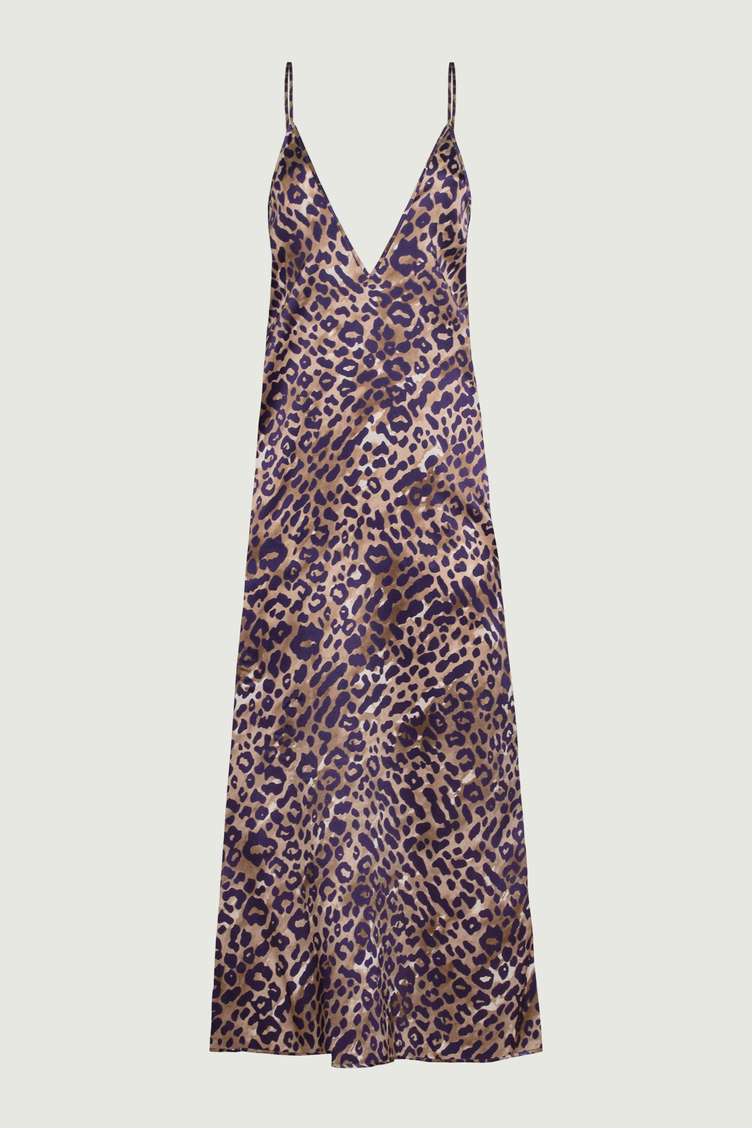 Leopard print silk slip dress with deep V neckline, front view highlighting fluid silhouette and bold animal pattern