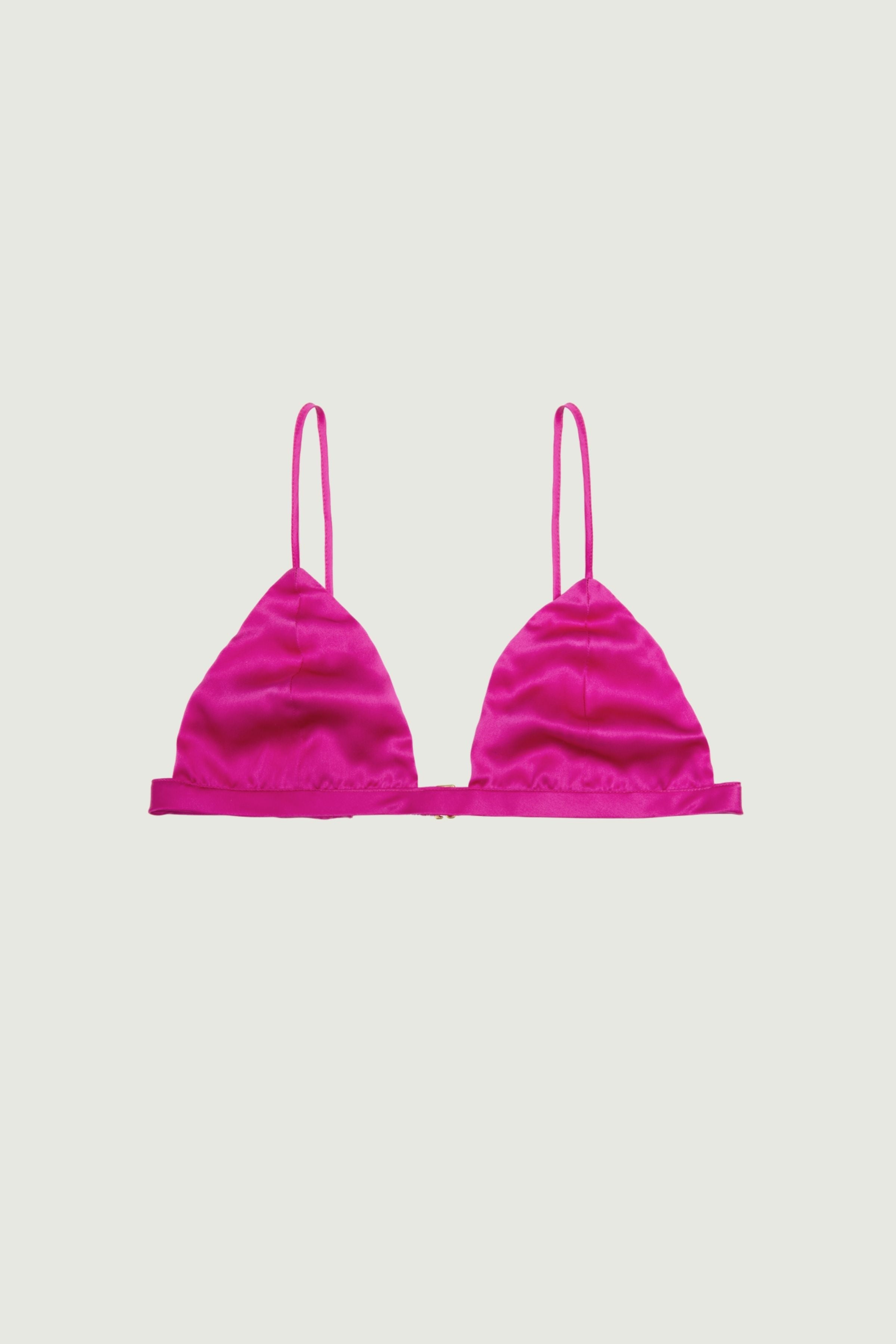 Hot pink silk triangle bra with soft cups and thin adjustable straps, front view highlighting vibrant color and lightweight minimal shape
