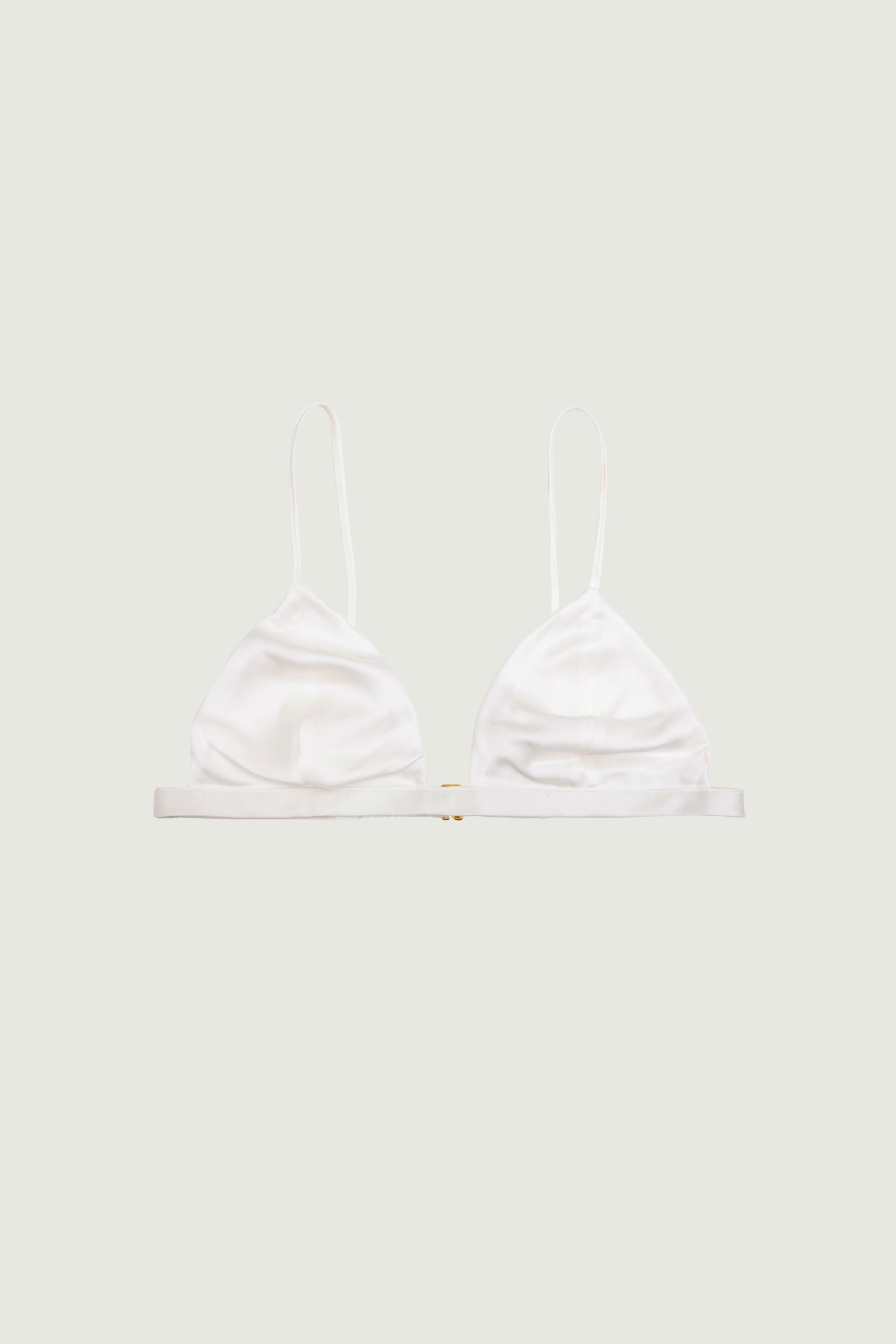 Ivory silk triangle bra with soft cups and thin adjustable straps, front view highlighting light tone and clean minimal shape