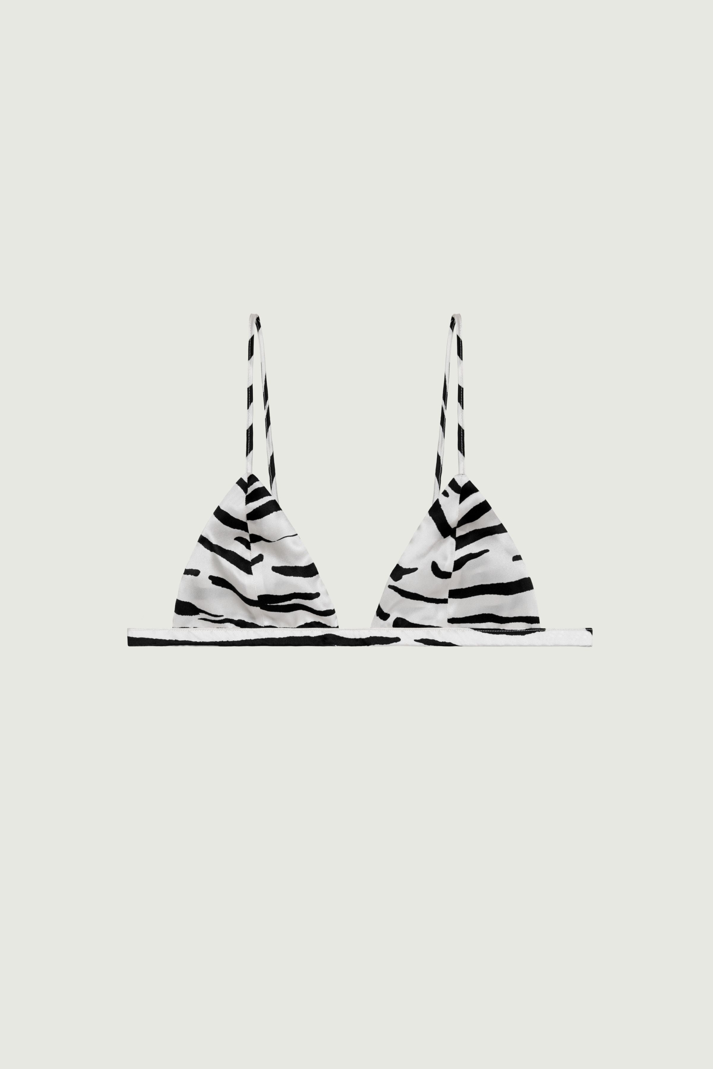 Zebra print silk triangle bra with soft cups and thin adjustable straps, front view highlighting graphic pattern and fluid minimal shape