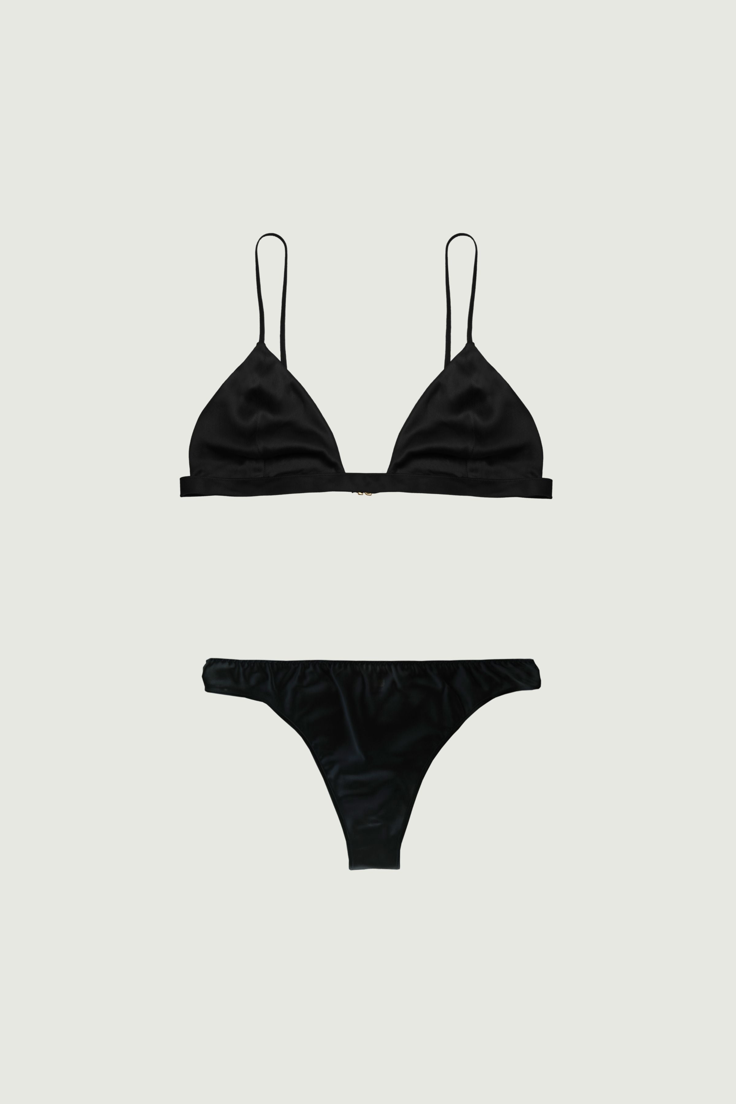 Black silk lingerie set with triangle bra and low-rise panty, front view highlighting minimal coverage and clean lines